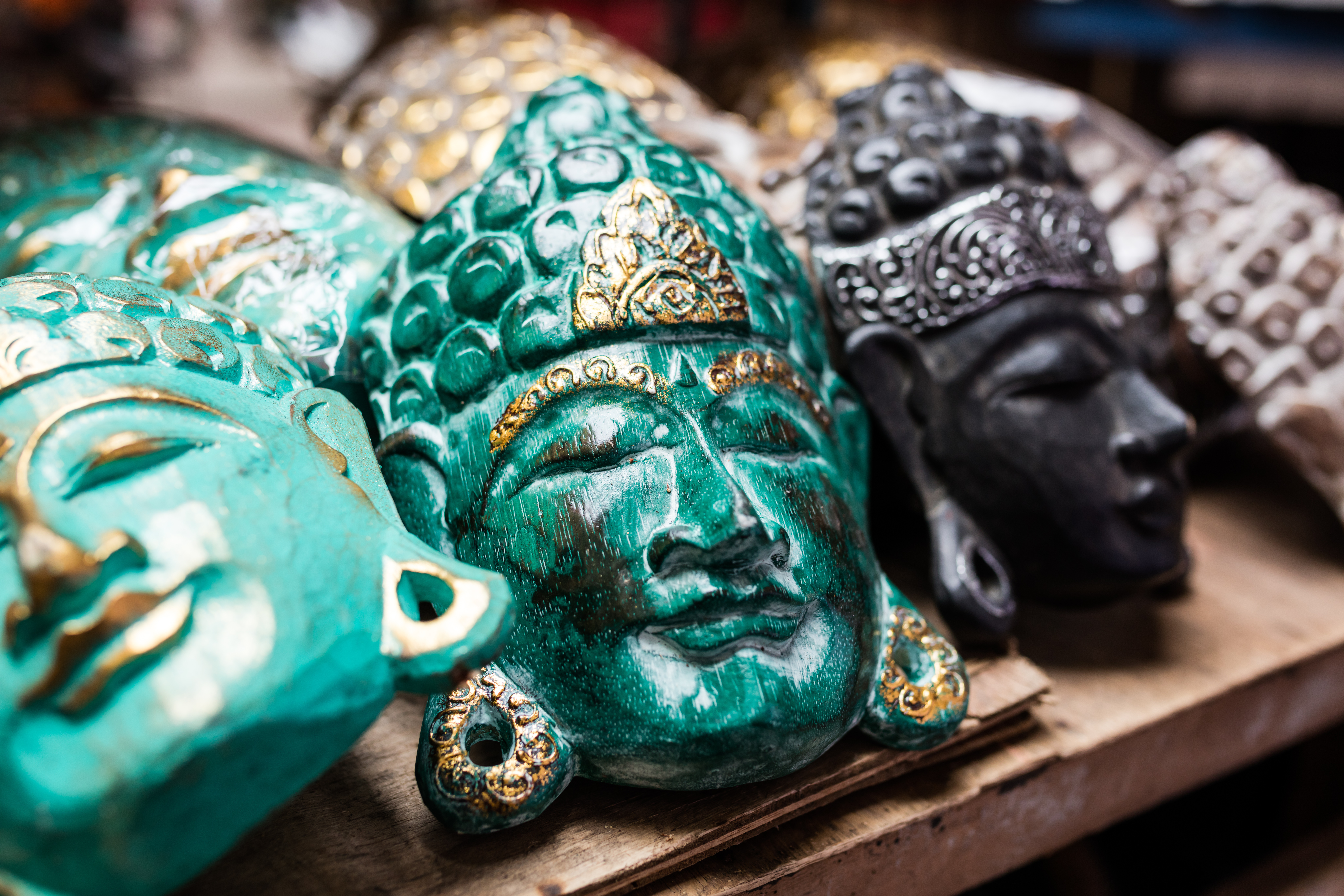 Traditional ancient mask souvenirs and handicrafts of Bali at the famous Ubud Market.