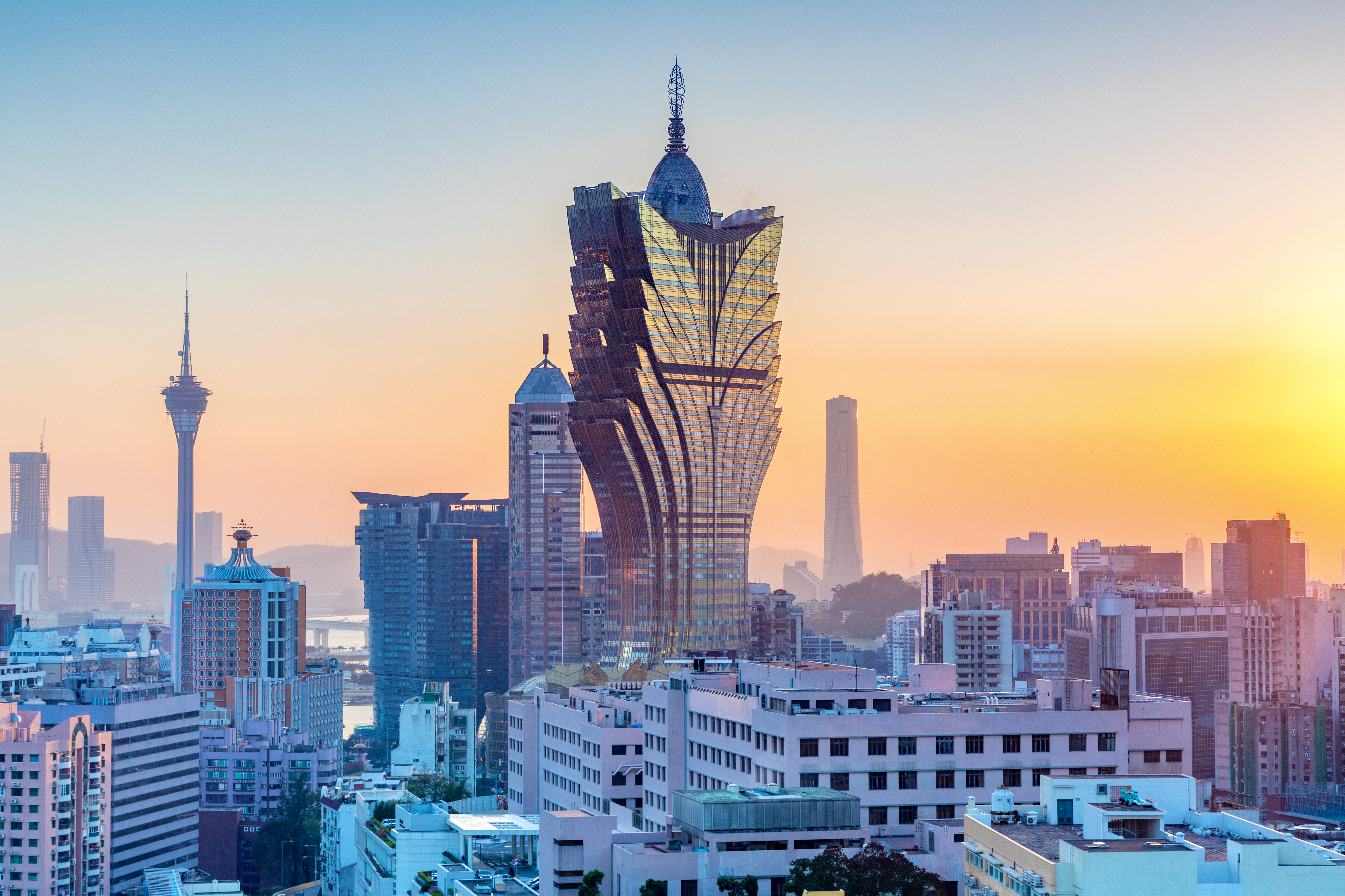 Macau, city skyline at sunset.