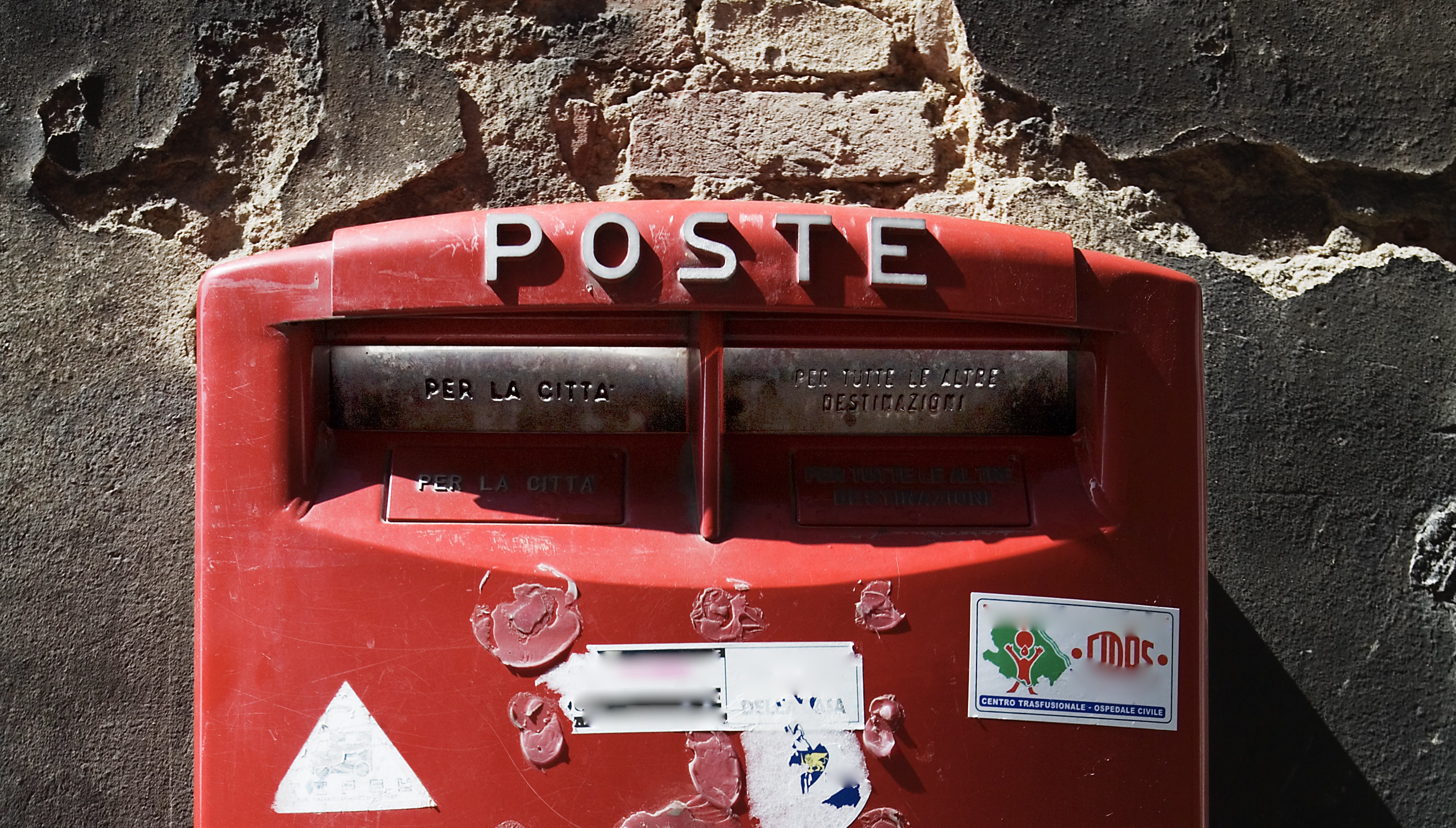 A red post box in Italy