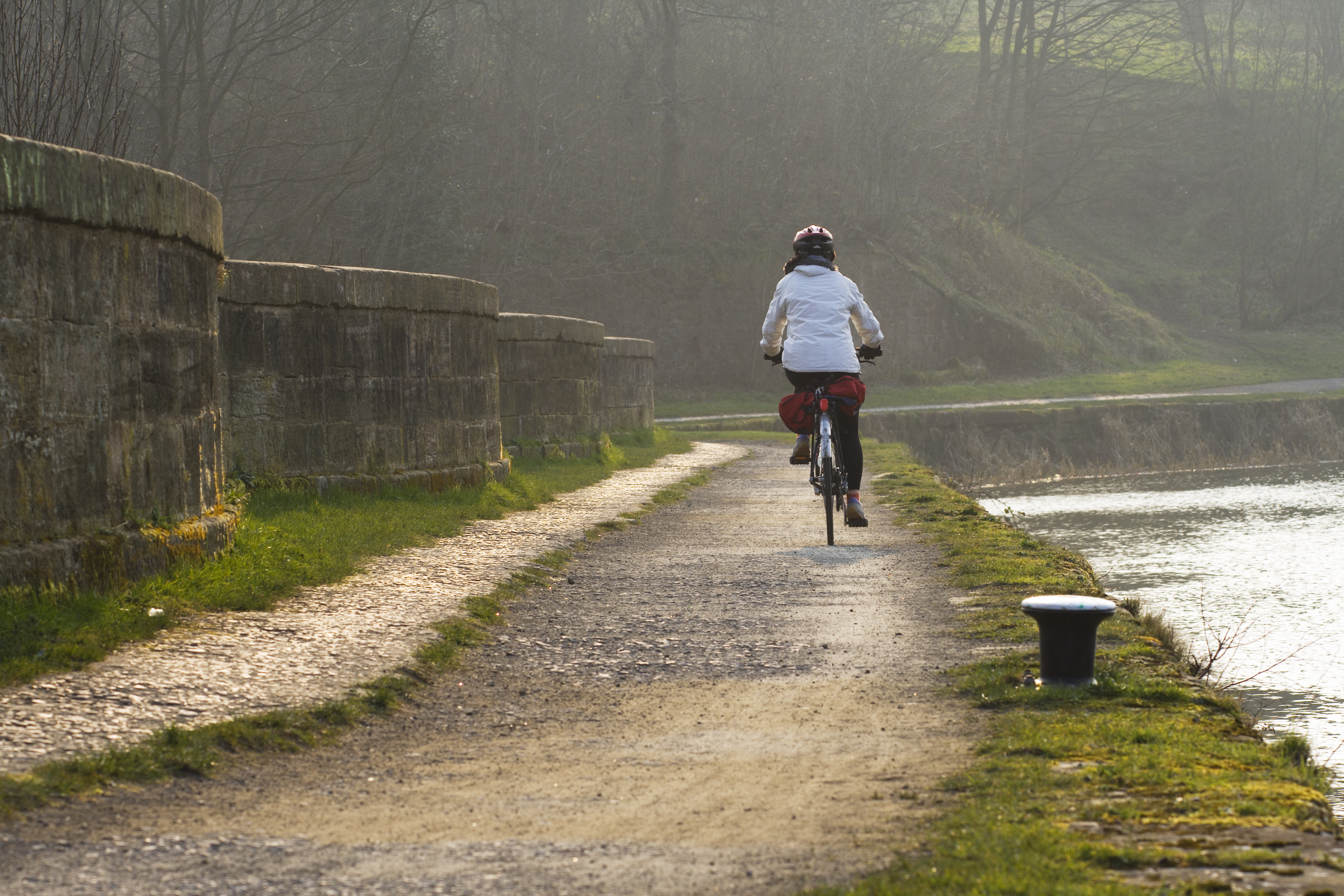 Cyclist in Glasgow over an aqueduct by Forth and Clyde Canal