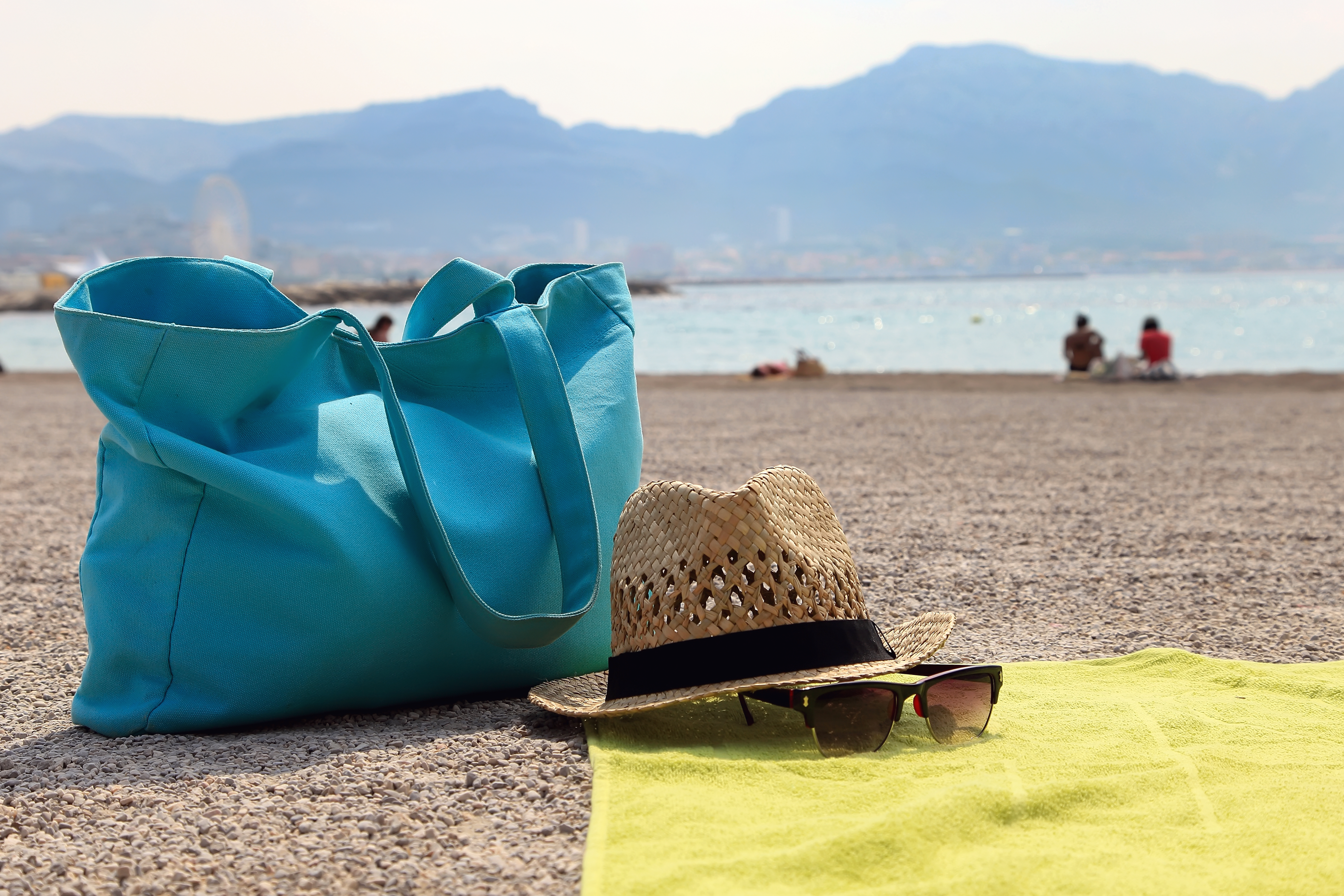 Hat, beach bag and the glasses on the rug
