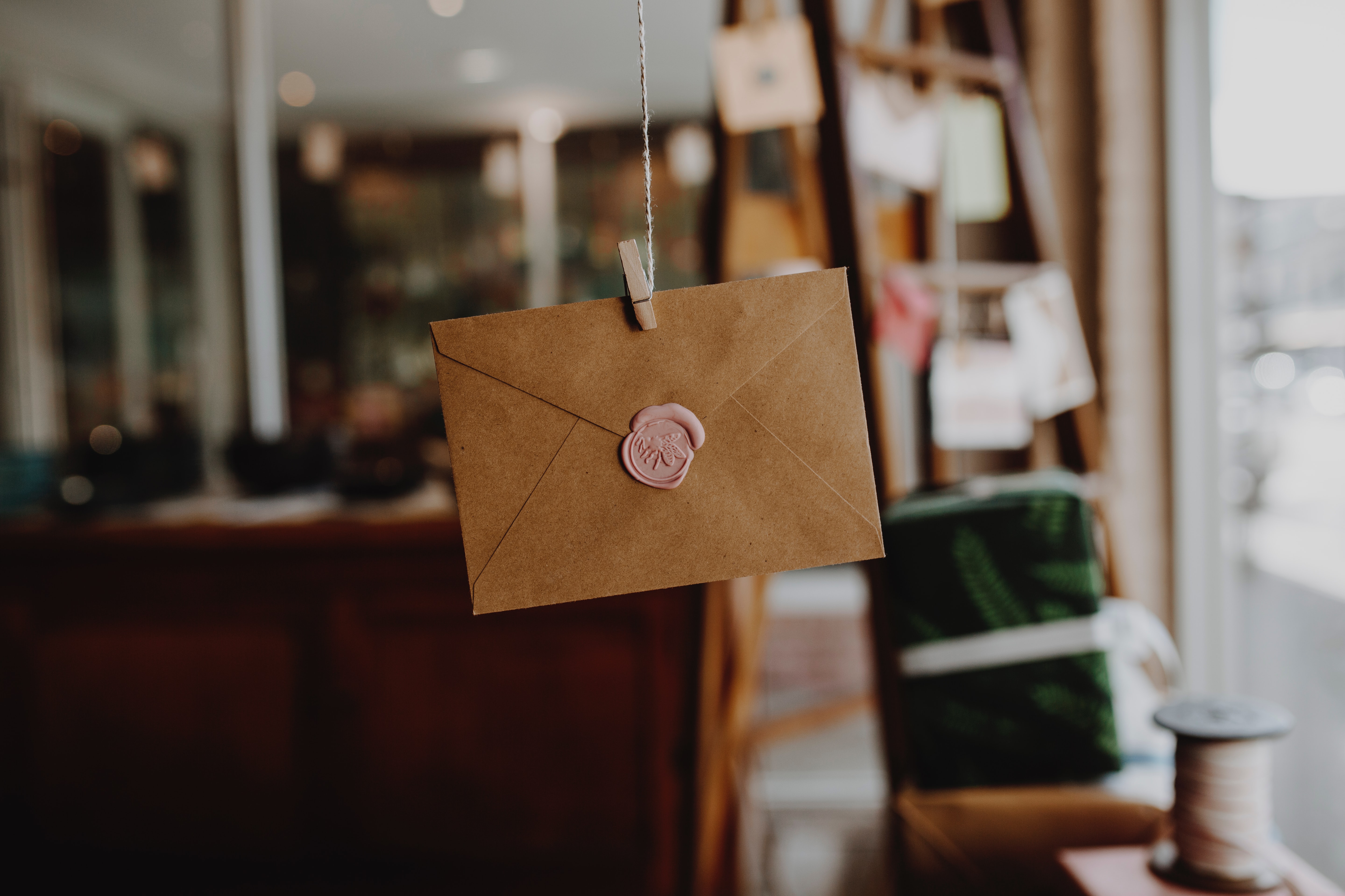 brown envelope hanging on a string