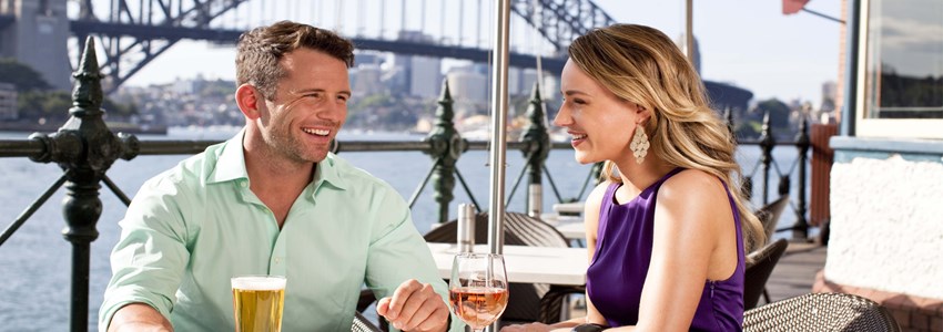 couple having lunch with a view of the Harbour Bridge