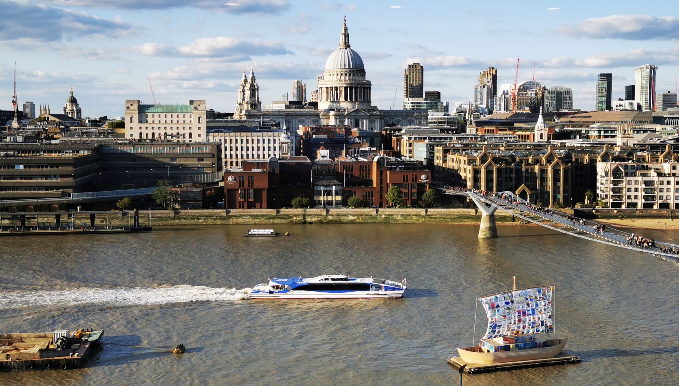 Thames Clippers boat with London city in the background