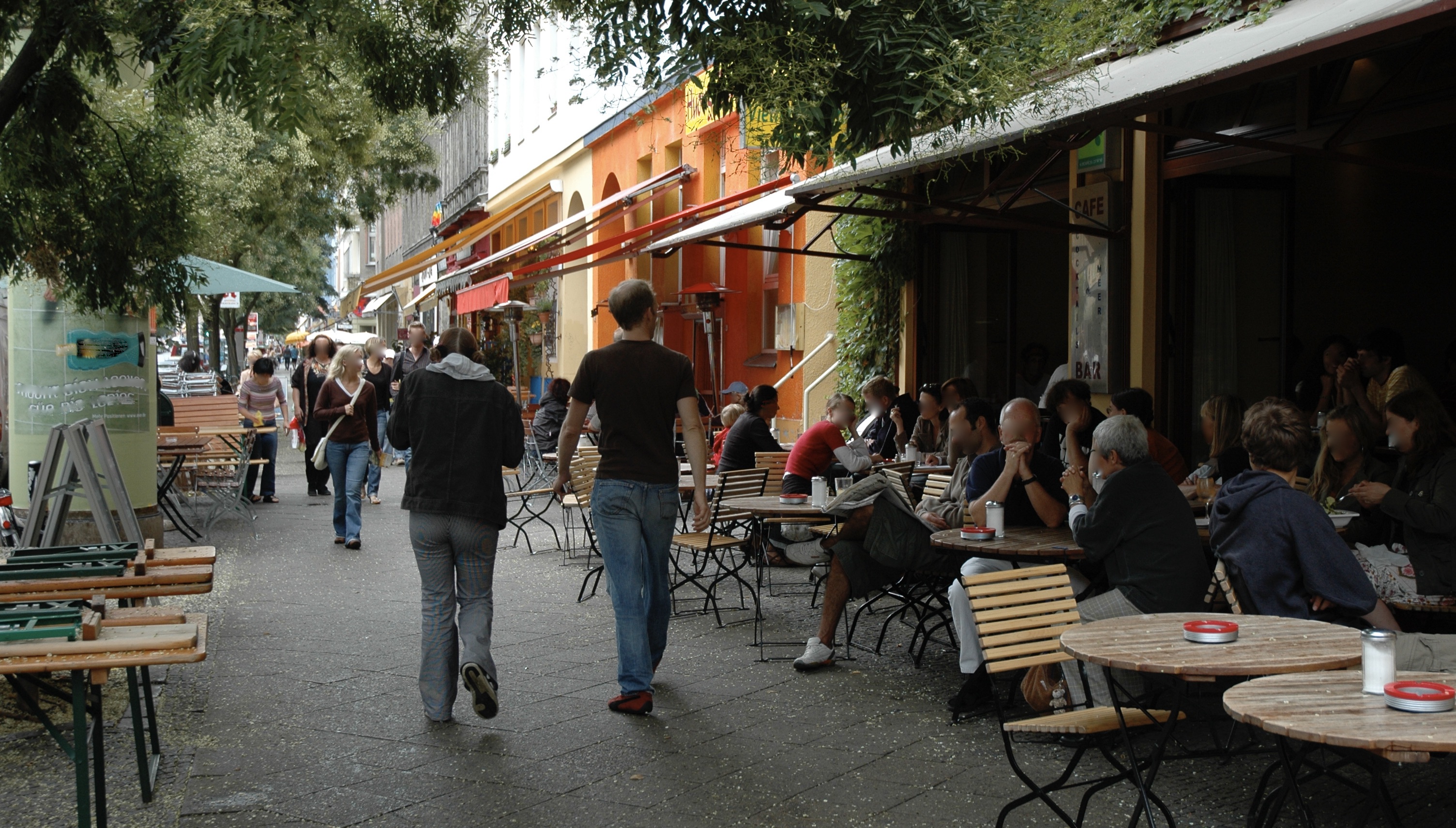 people sitting outside a cafe on Bergmannstr., Kreuzberg, Berlin, Germany