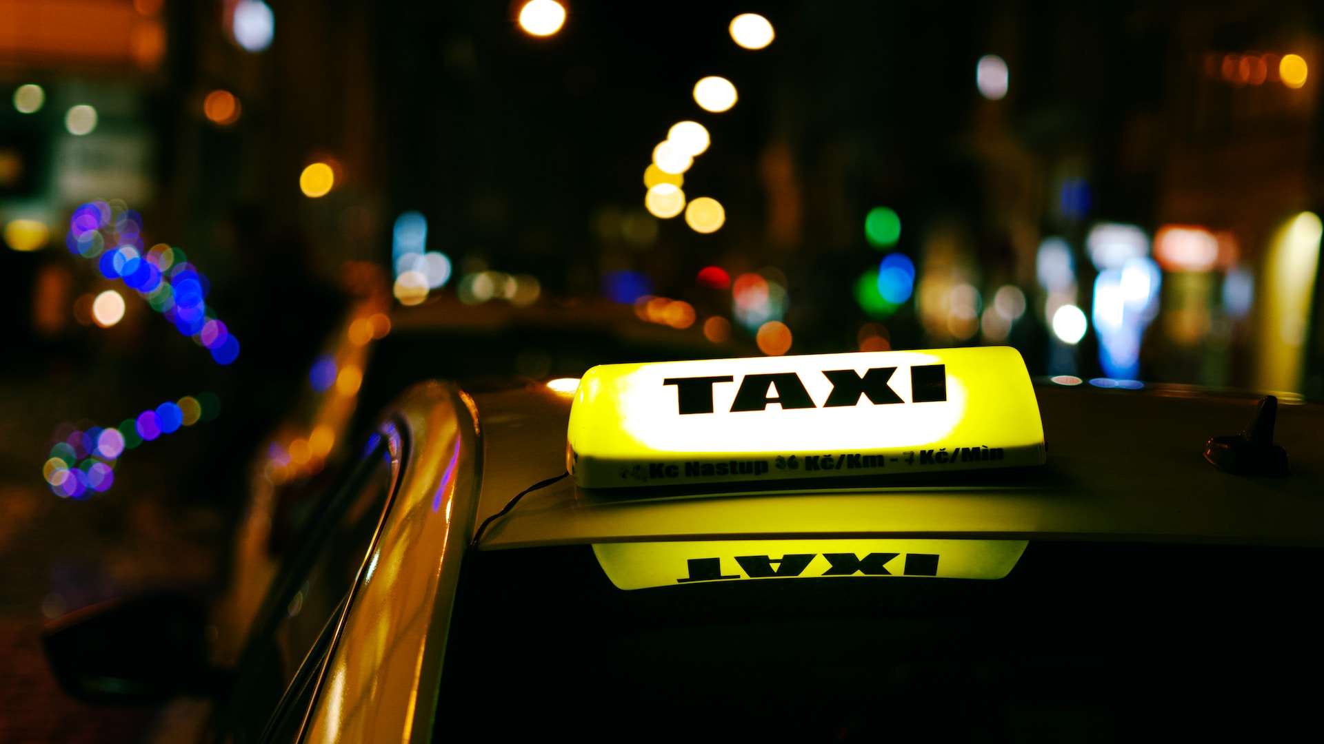 taxi cab with sign light at night