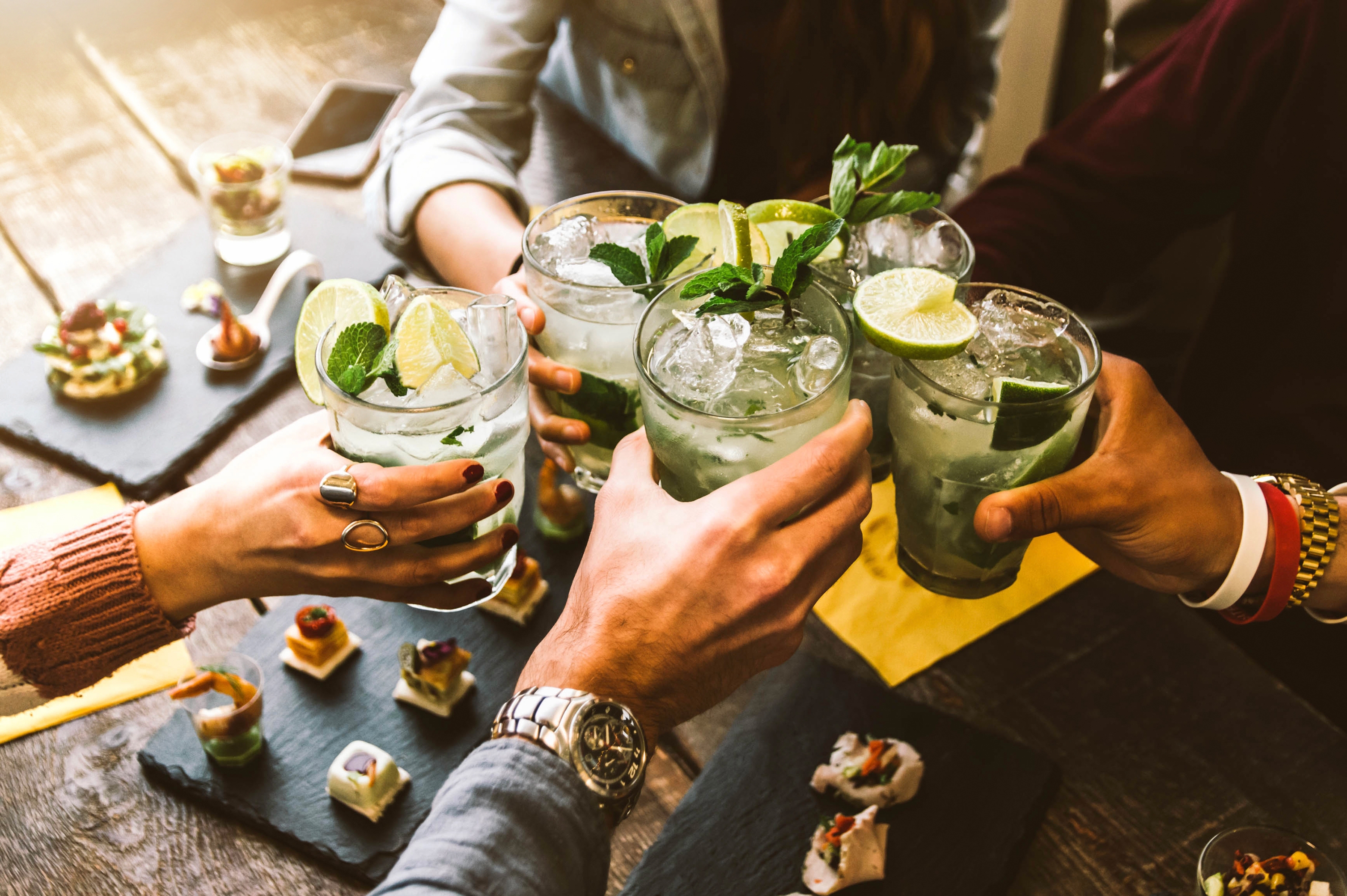 Young people having fun drinking cocktails