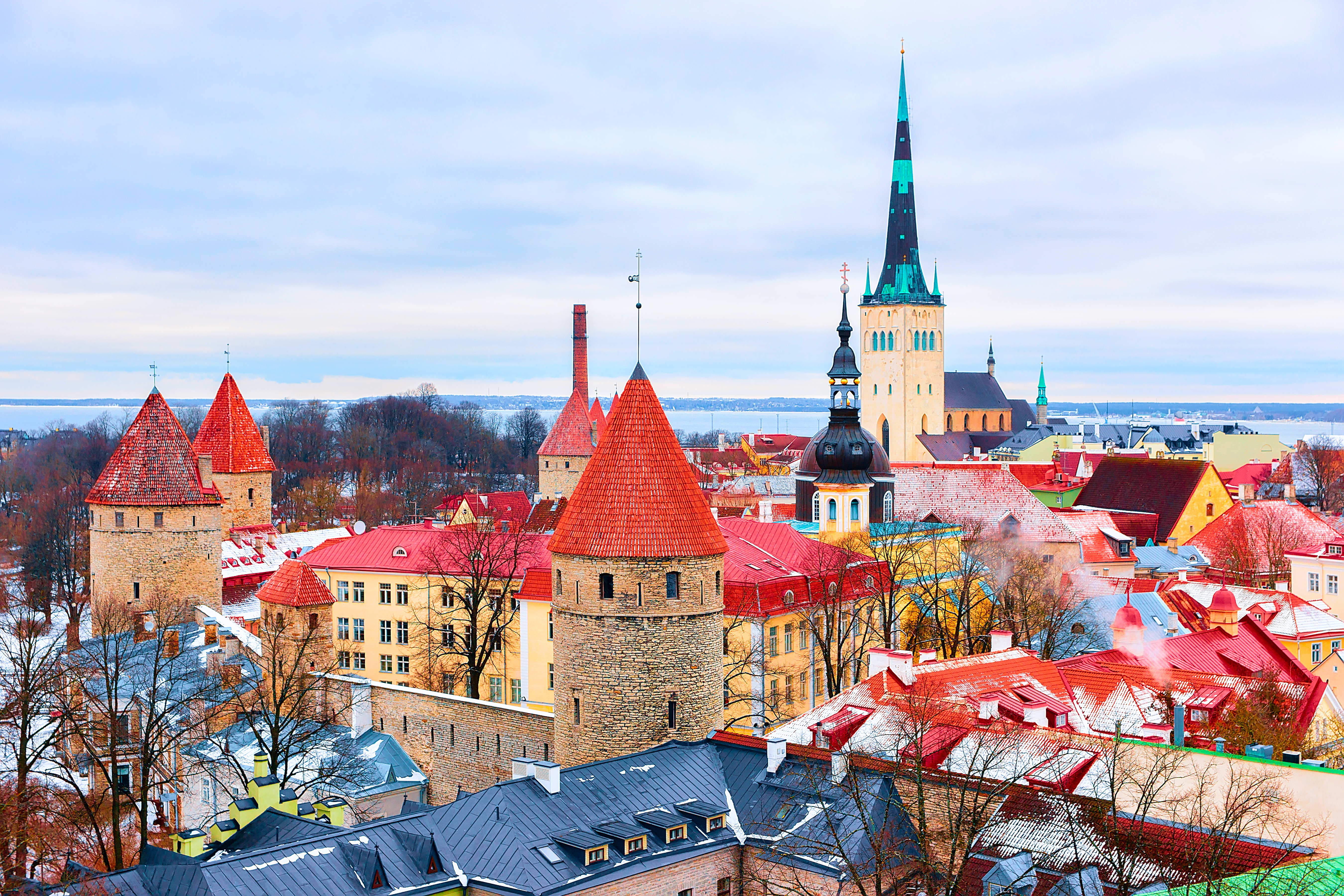 Cityscape with St Olaf Church and defensive towers at the Old town of Tallinn, Estonia in winter.