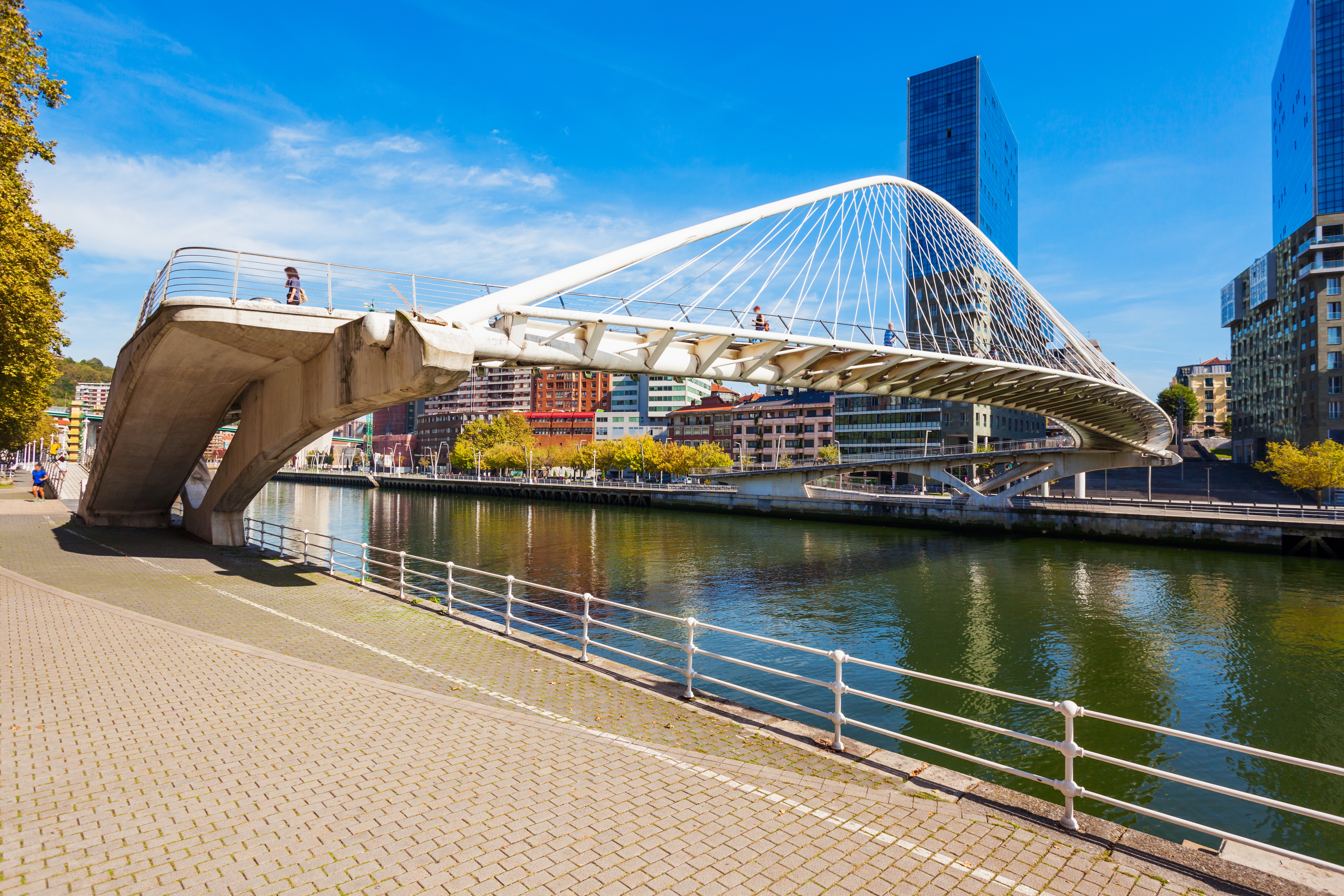 Zubizuri Bridge, Nervion River embankment in the centre of Bilbao, largest city in the Basque Country in northern Spain