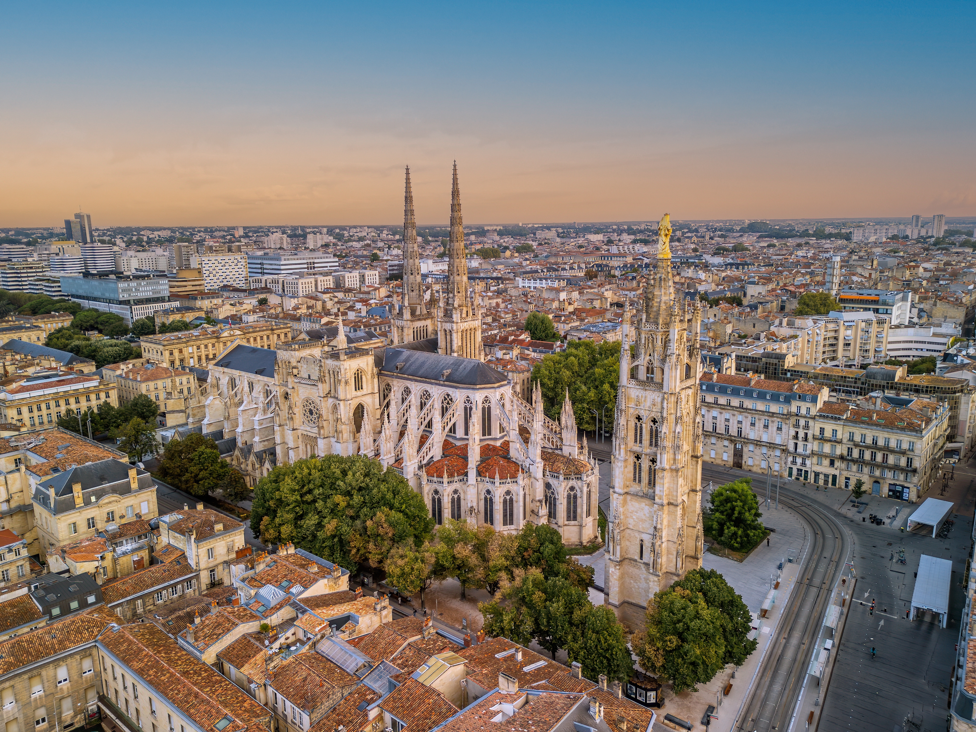 The drone aerial view of Bordeaux Cathedral and Pey Berland Tower at sunrise, Bordeaux, France.