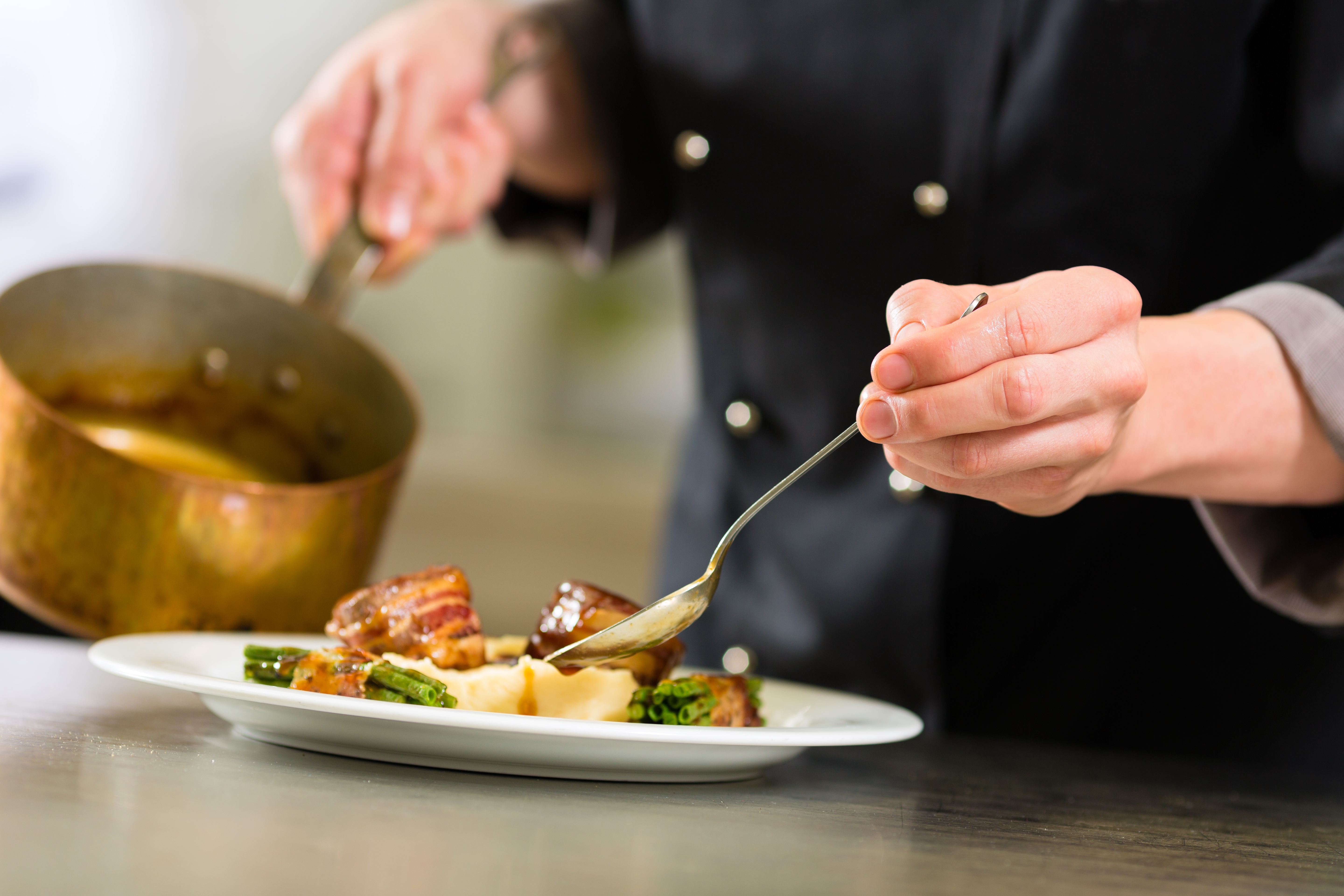 Chef in a restaurant kitchen cooking food