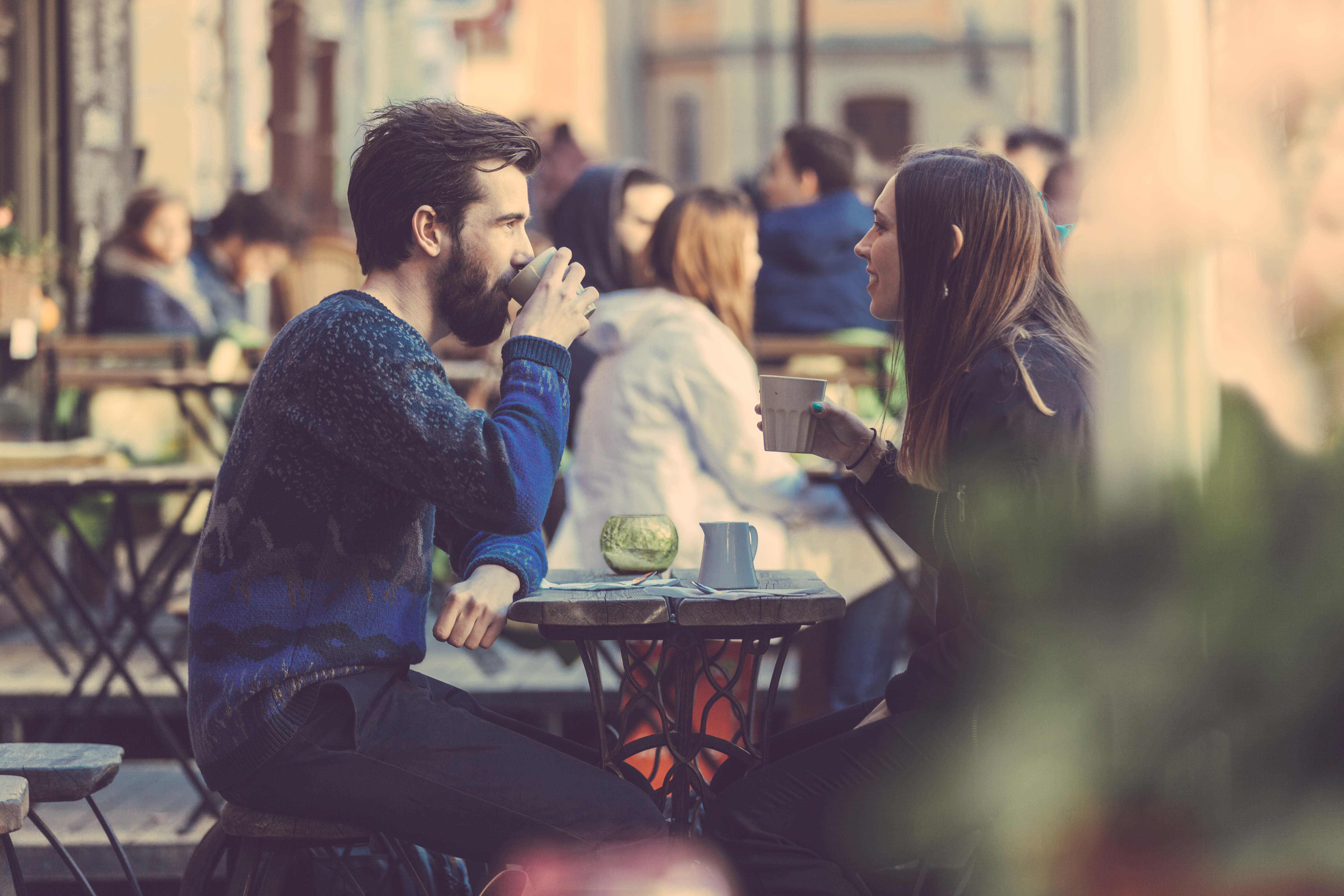 Couple having coffee outside - Tallinn, Estonia