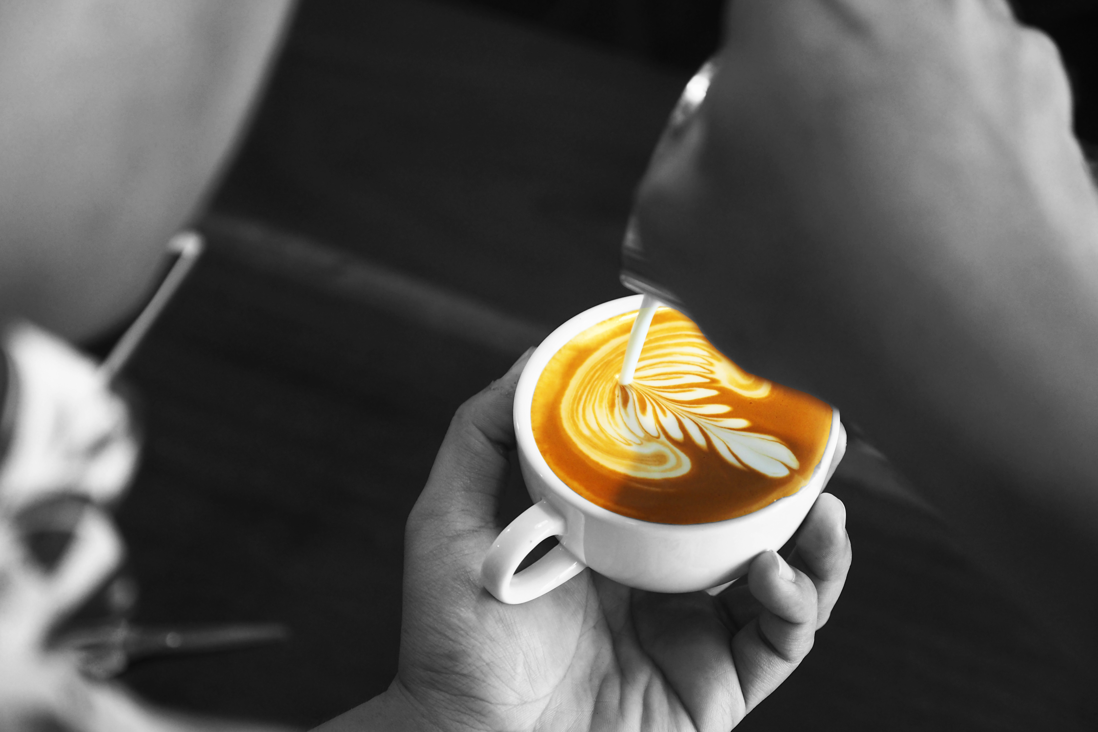 Barista pouring cafe