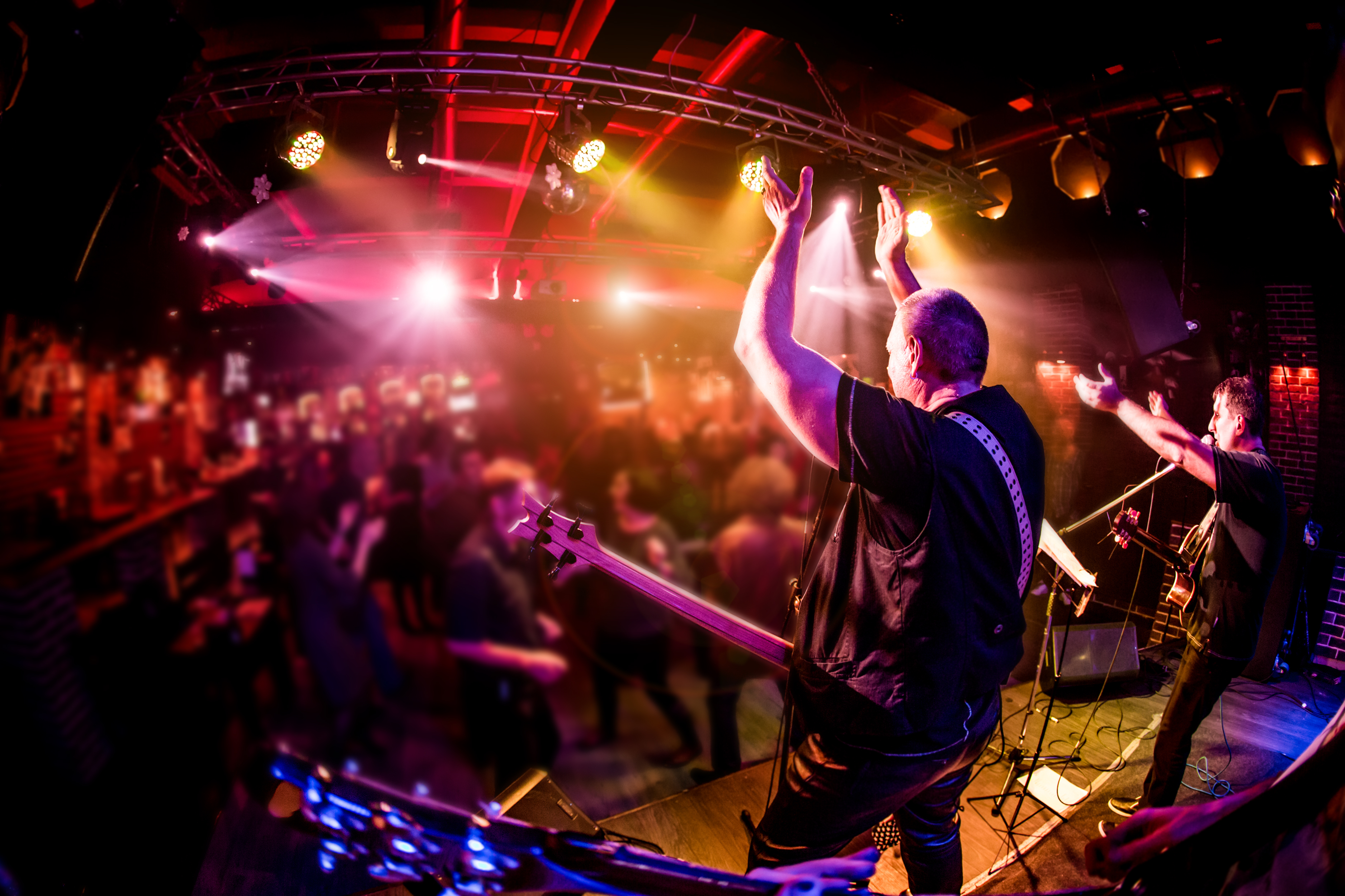 Band performs on stage, rock music concert