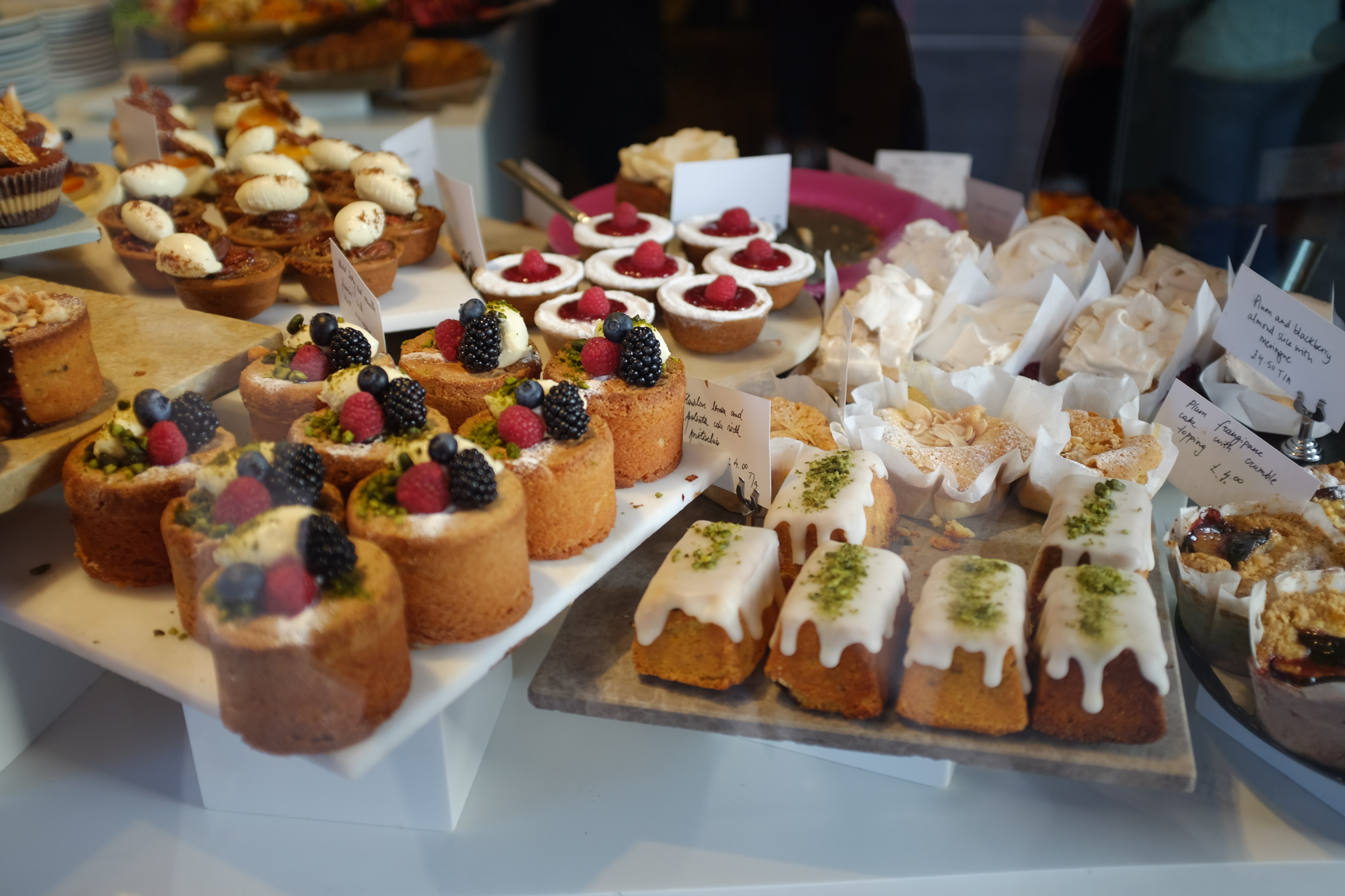 pastries arranged in a vitrine, Pasticceria Cova, Milan, Italy