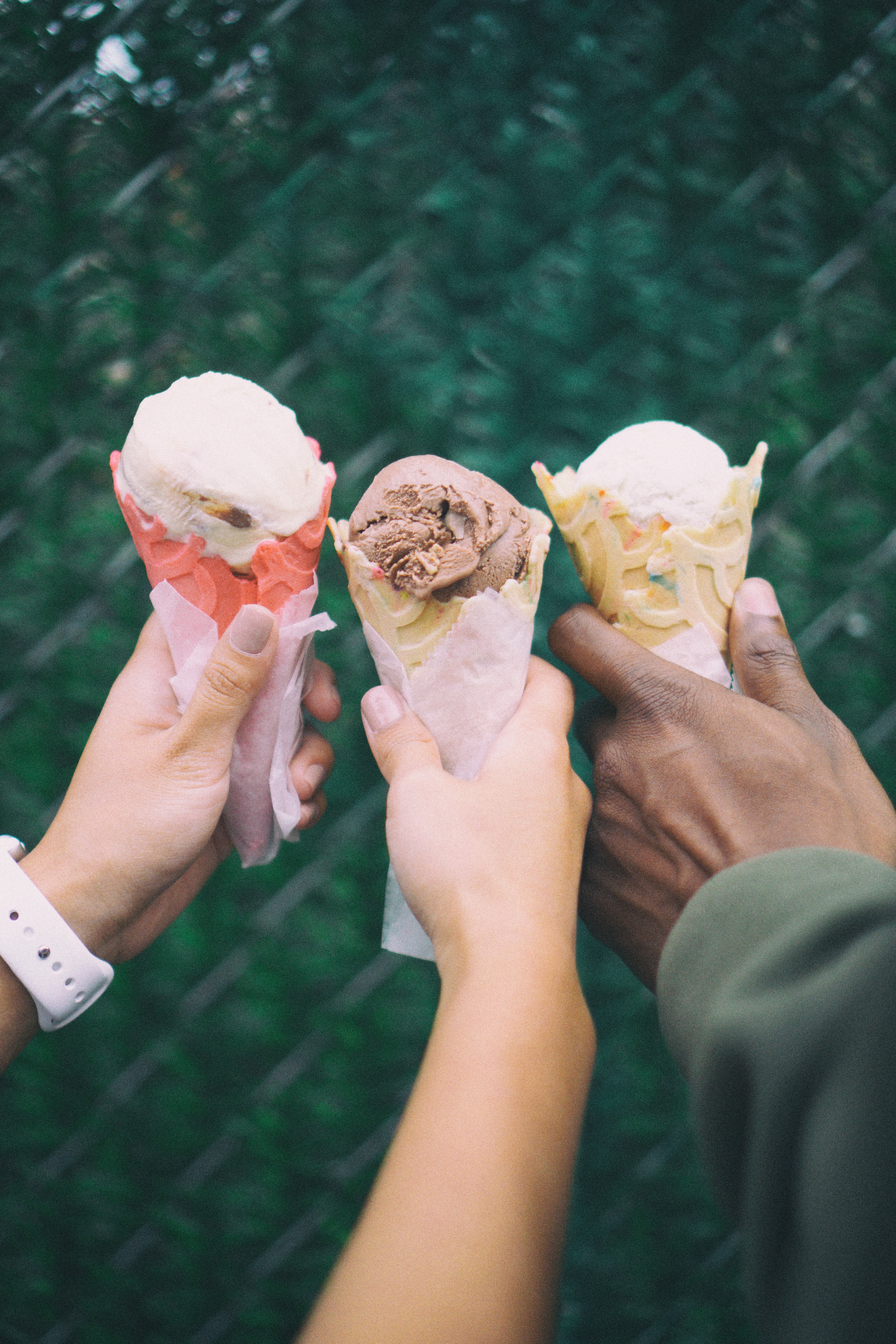 Friends holding ice cream cones in Venice, Italy
