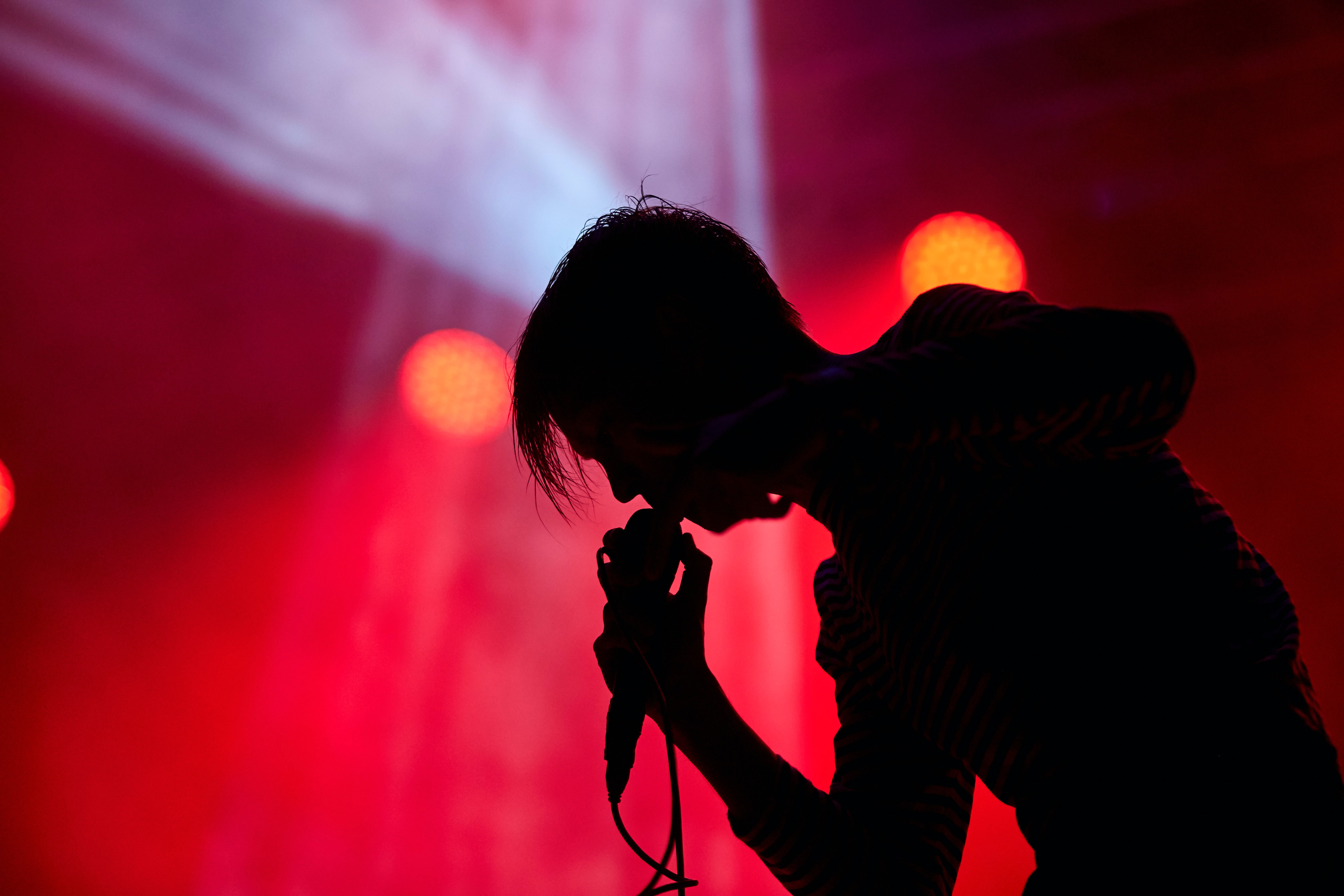 silhouette of a singer in nightclub, Magazzini Generali, Milan, Italy