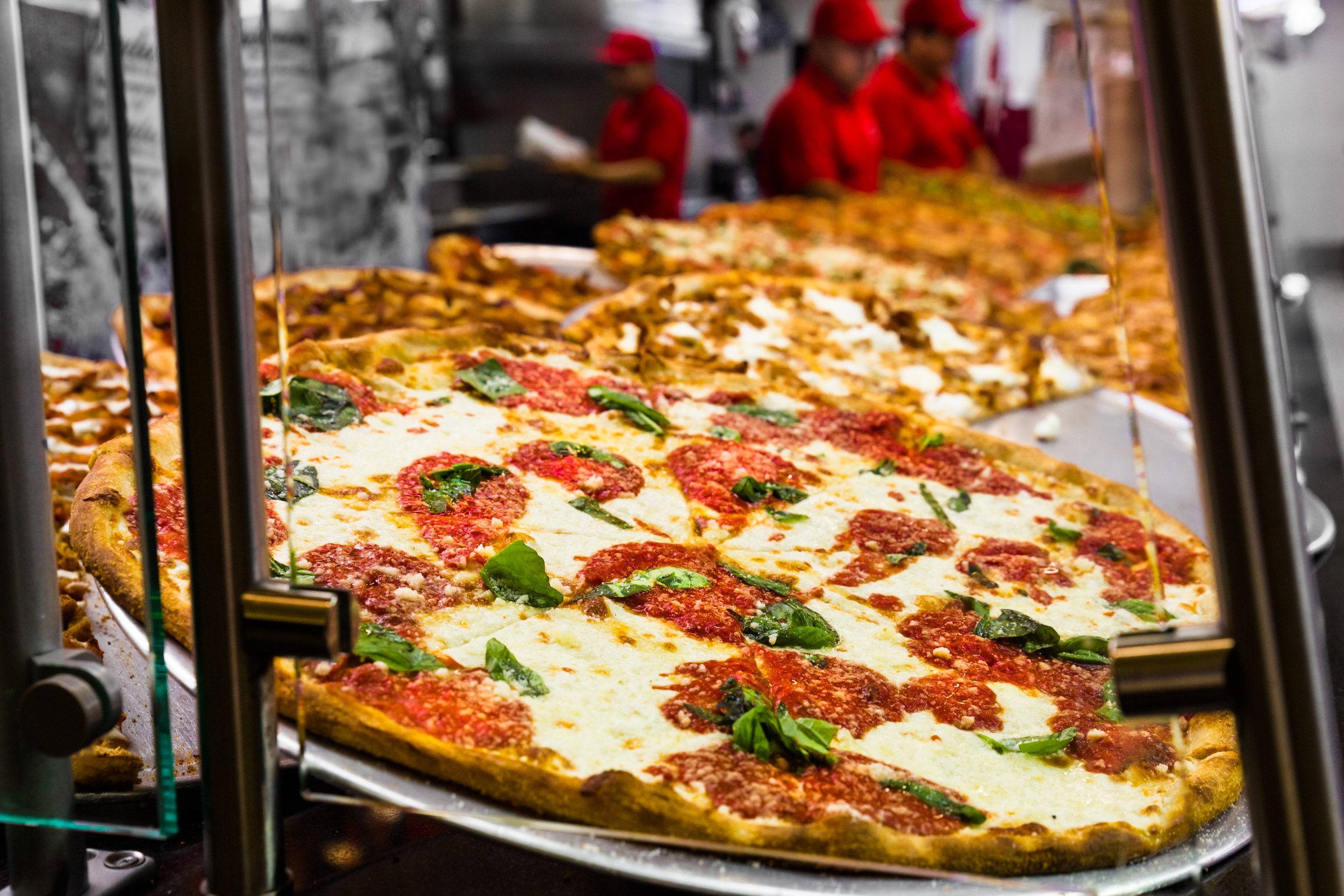 Fresh Italian pizza in New York City pizzeria window