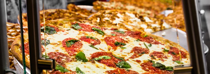 Fresh Italian pizza in New York City pizzeria window