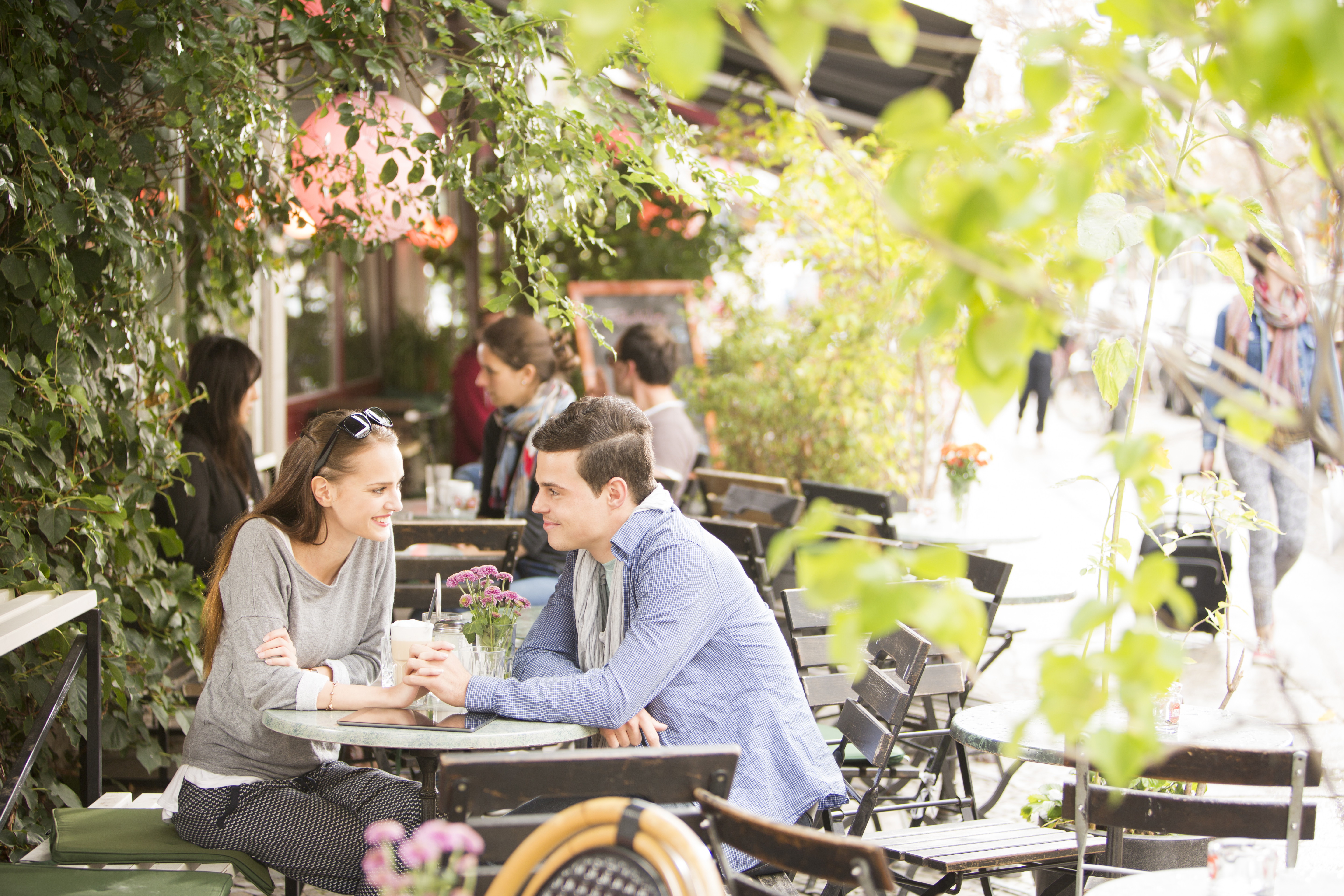 Young people at a cafe in the summer