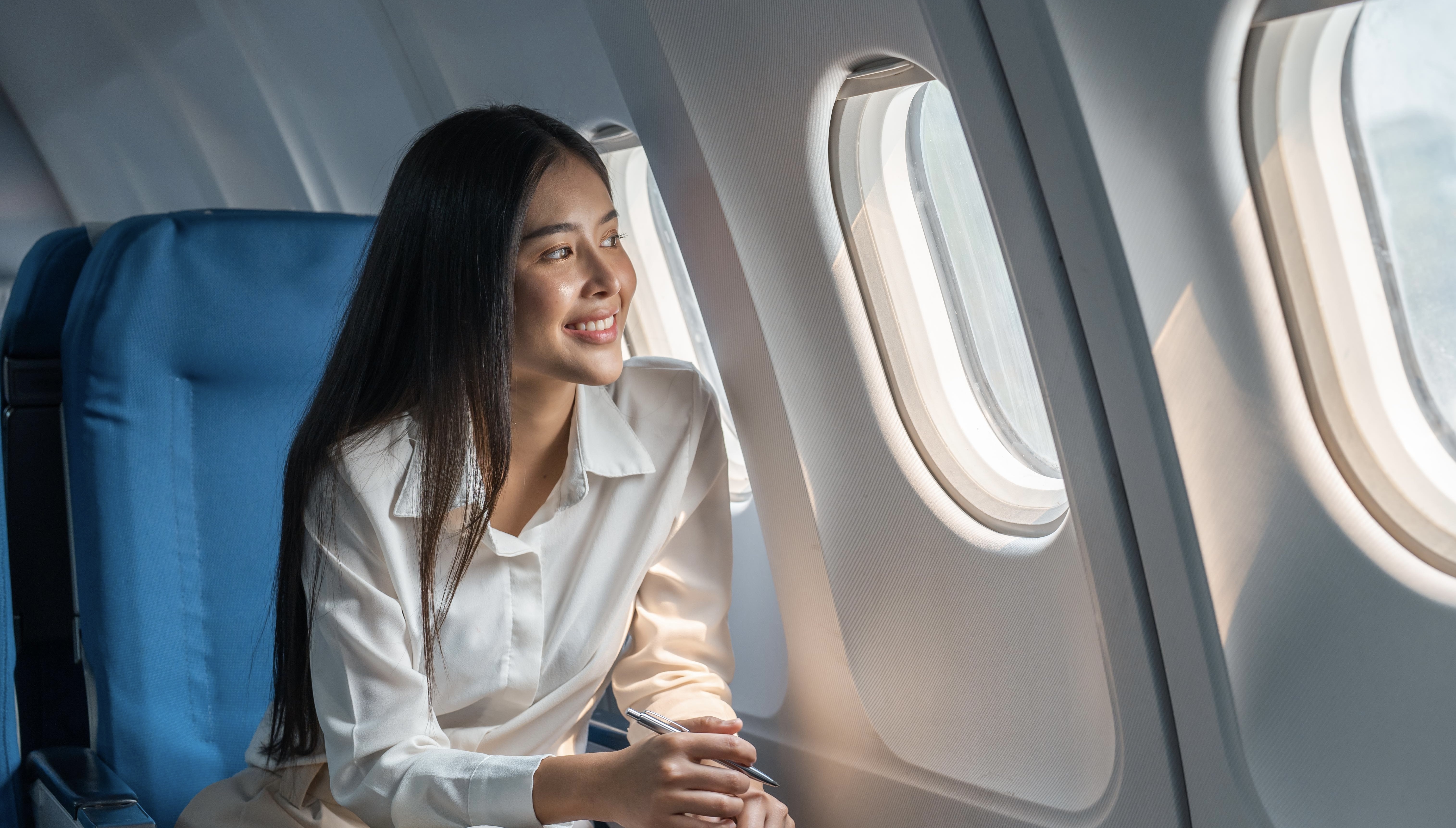 woman sitting in a seat in airplane