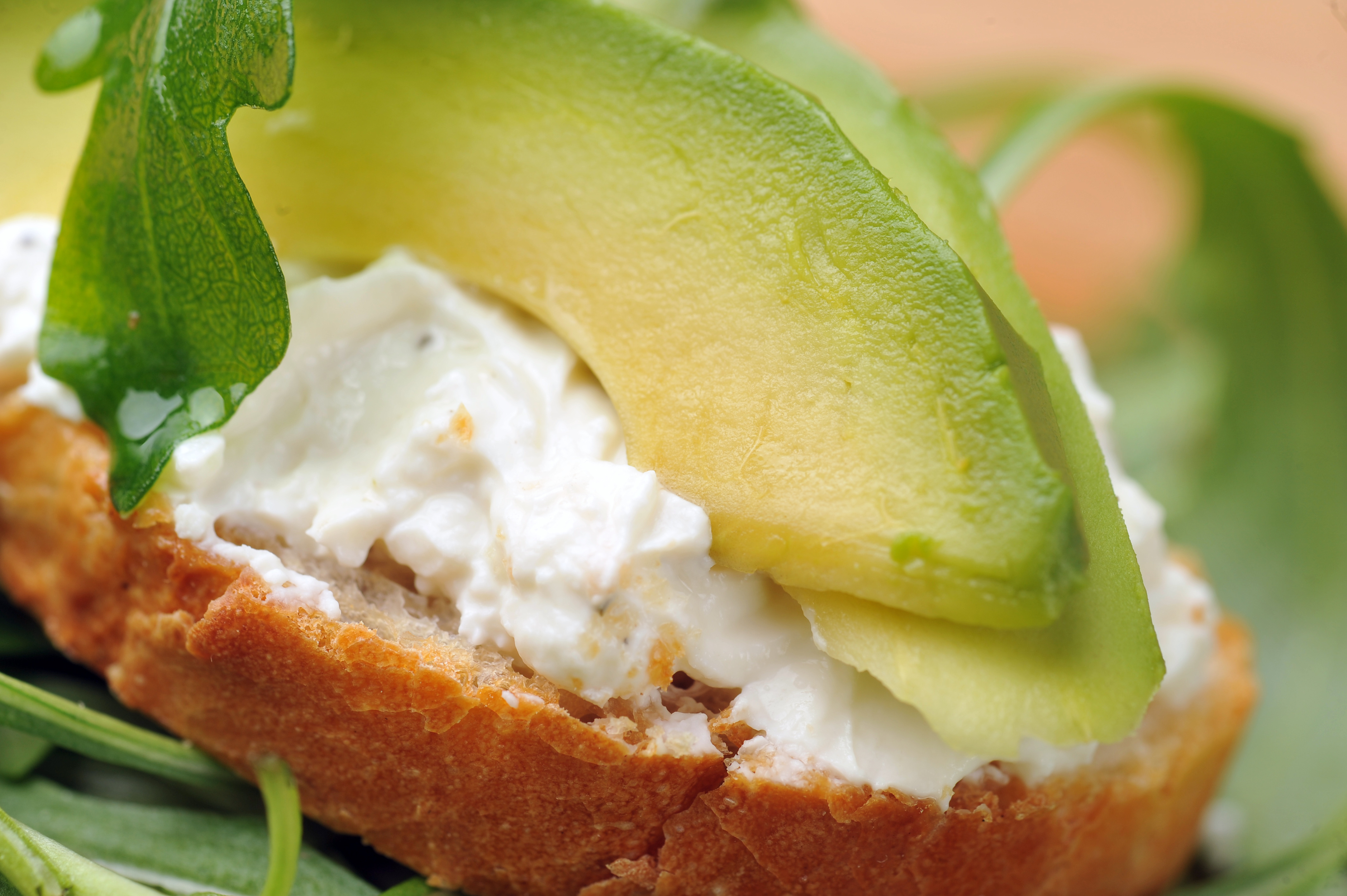 delicious sandwich of toasted bread, avocado and spinach