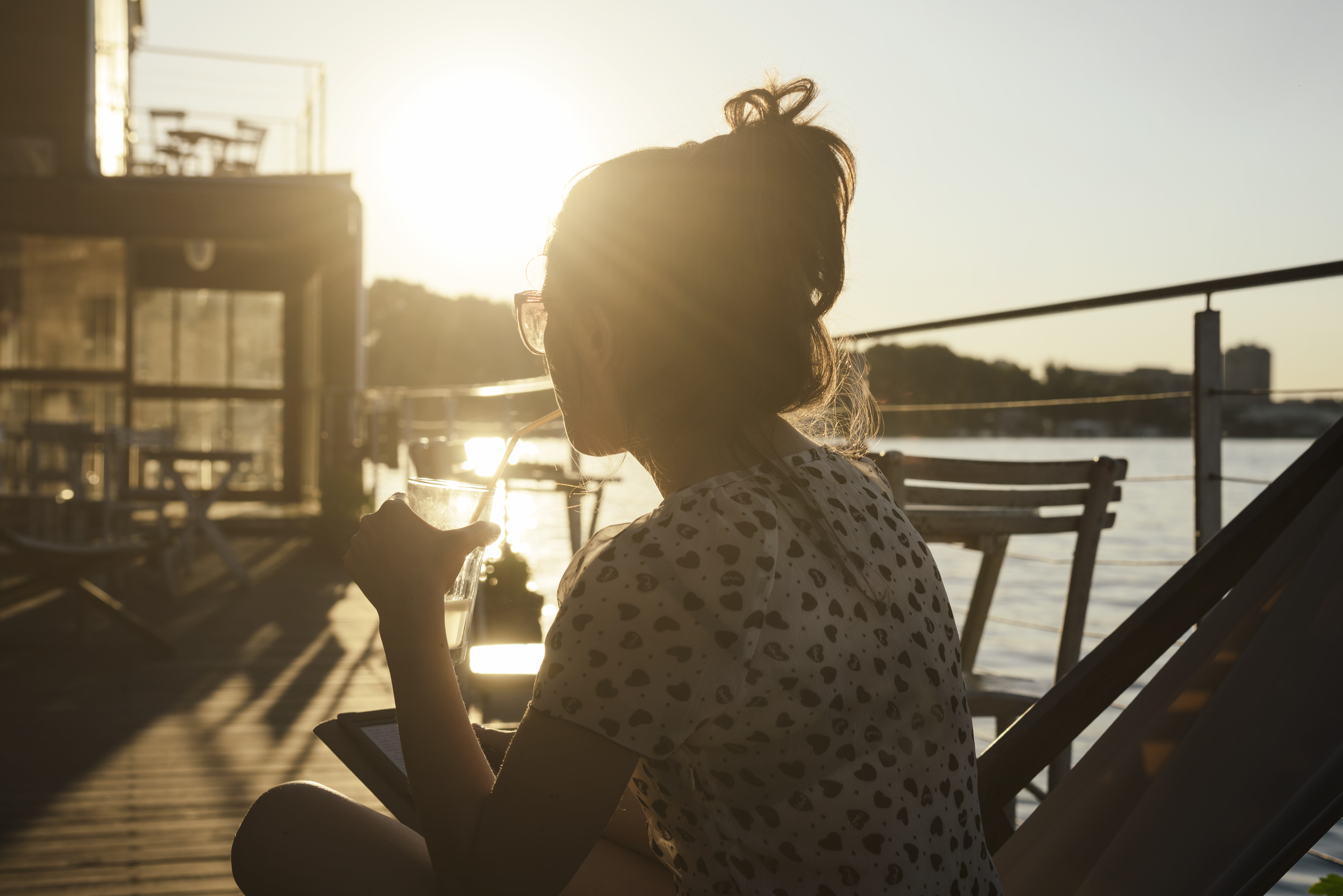 Woman at bar on pier