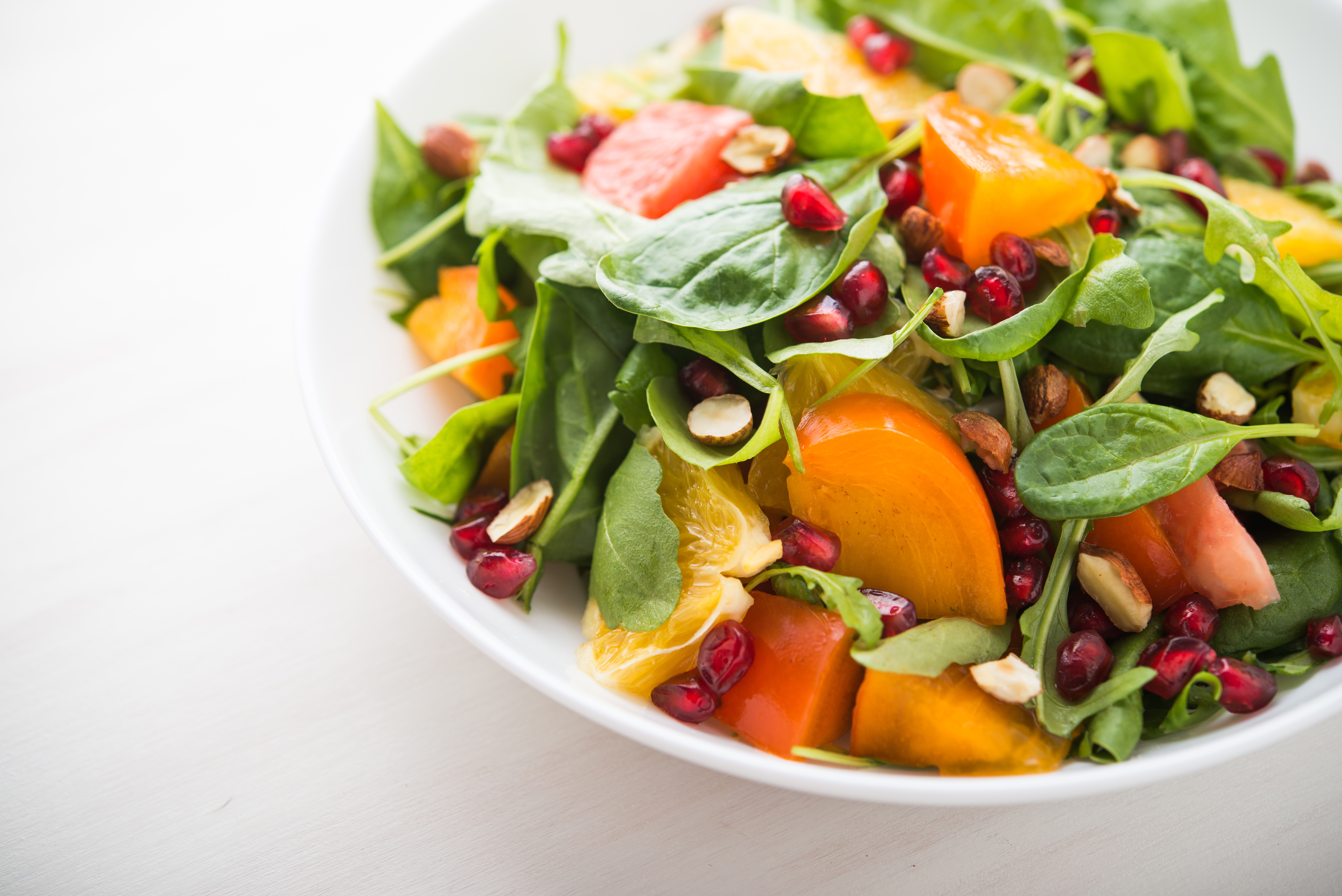 Fresh salad with fruits and greens