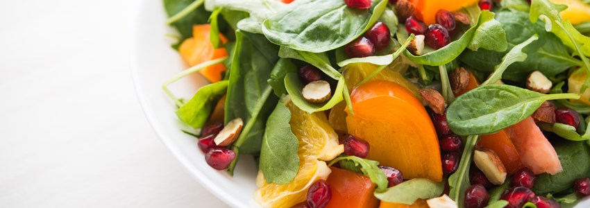 Fresh salad with fruits and greens
