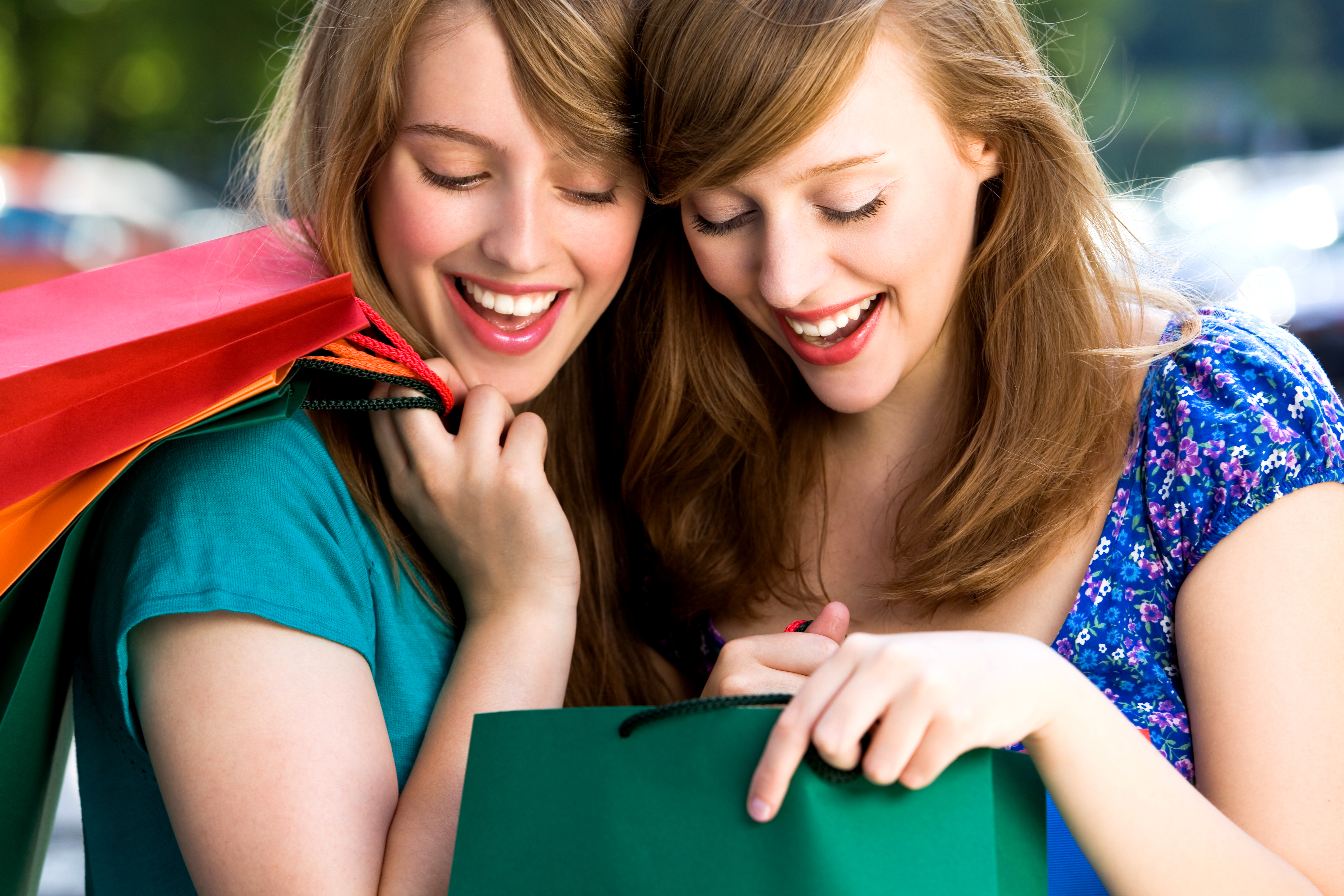 Women looking in shopping bags