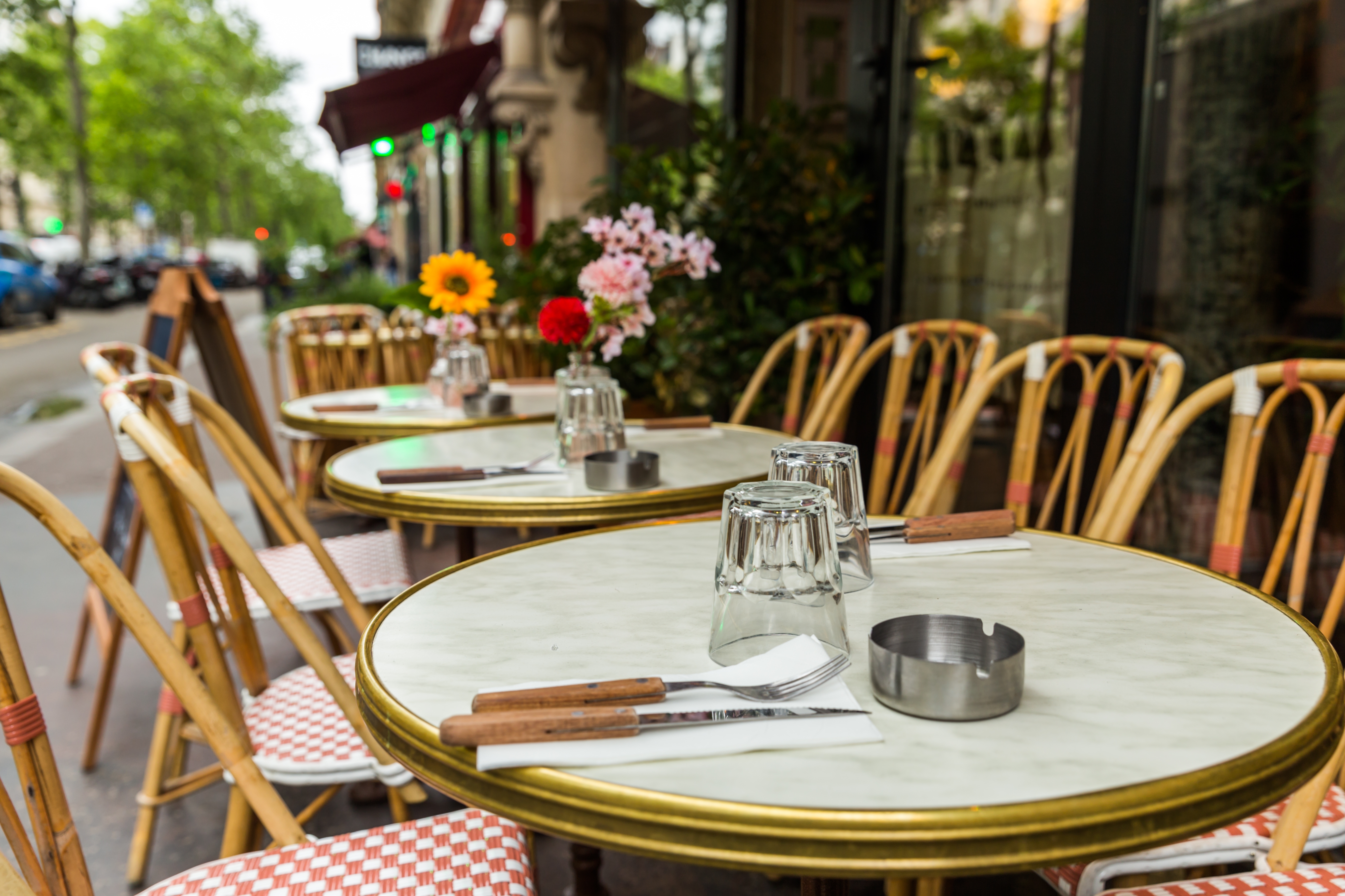 Close-up of a French restaurant table in daylight.