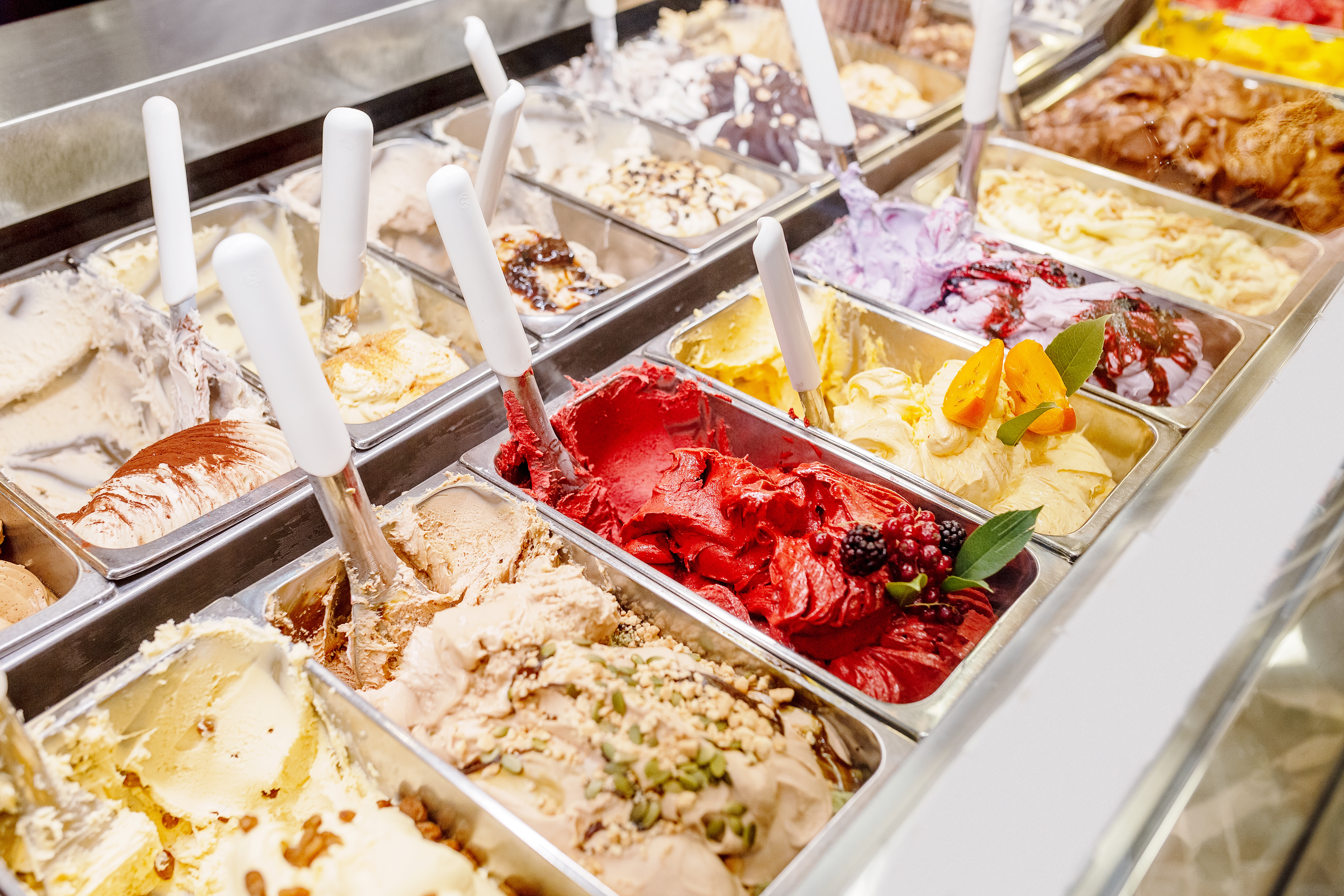 various flavors of gelato ice-cream at the showcase in a dessert shop in Rome