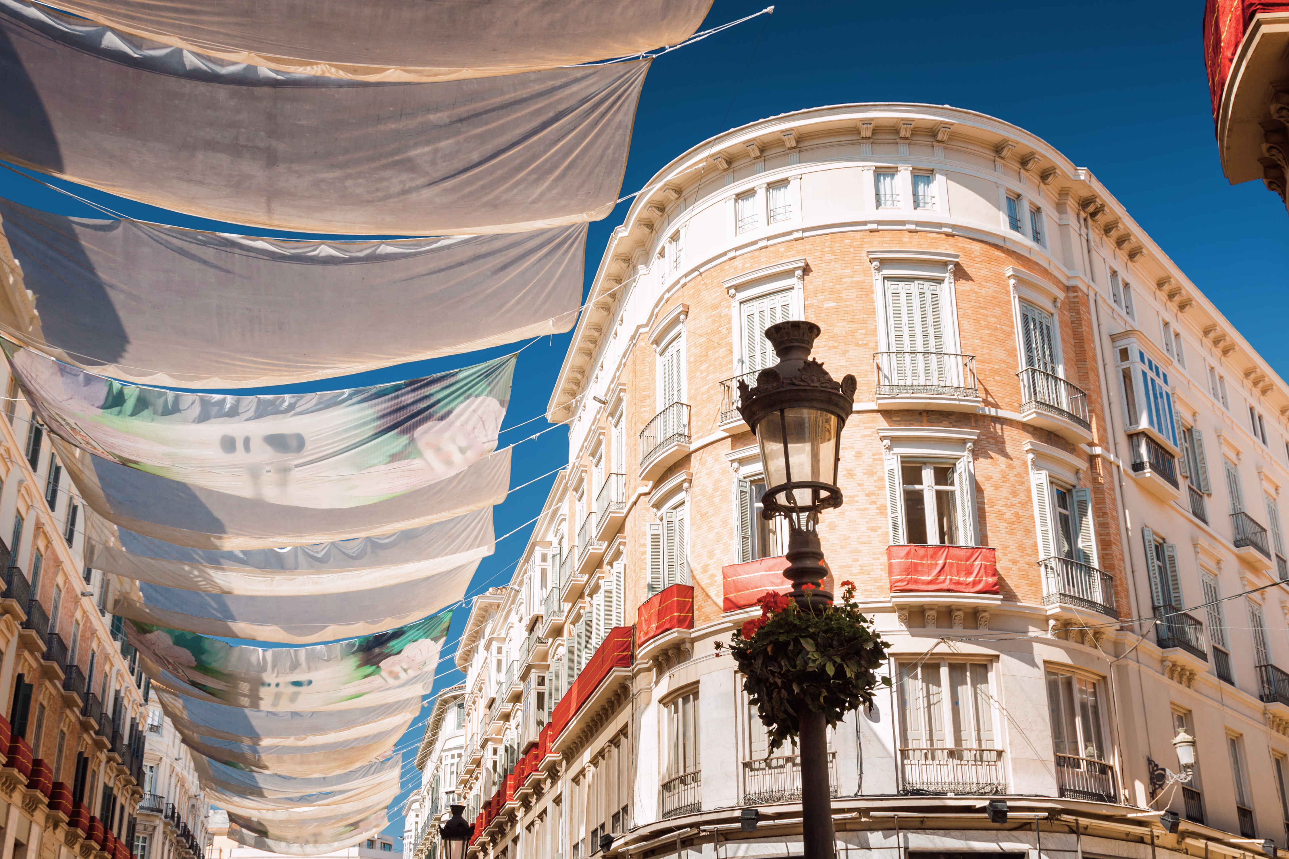 Sunny view of Larios street in Malaga, Andalusia province, Spain.