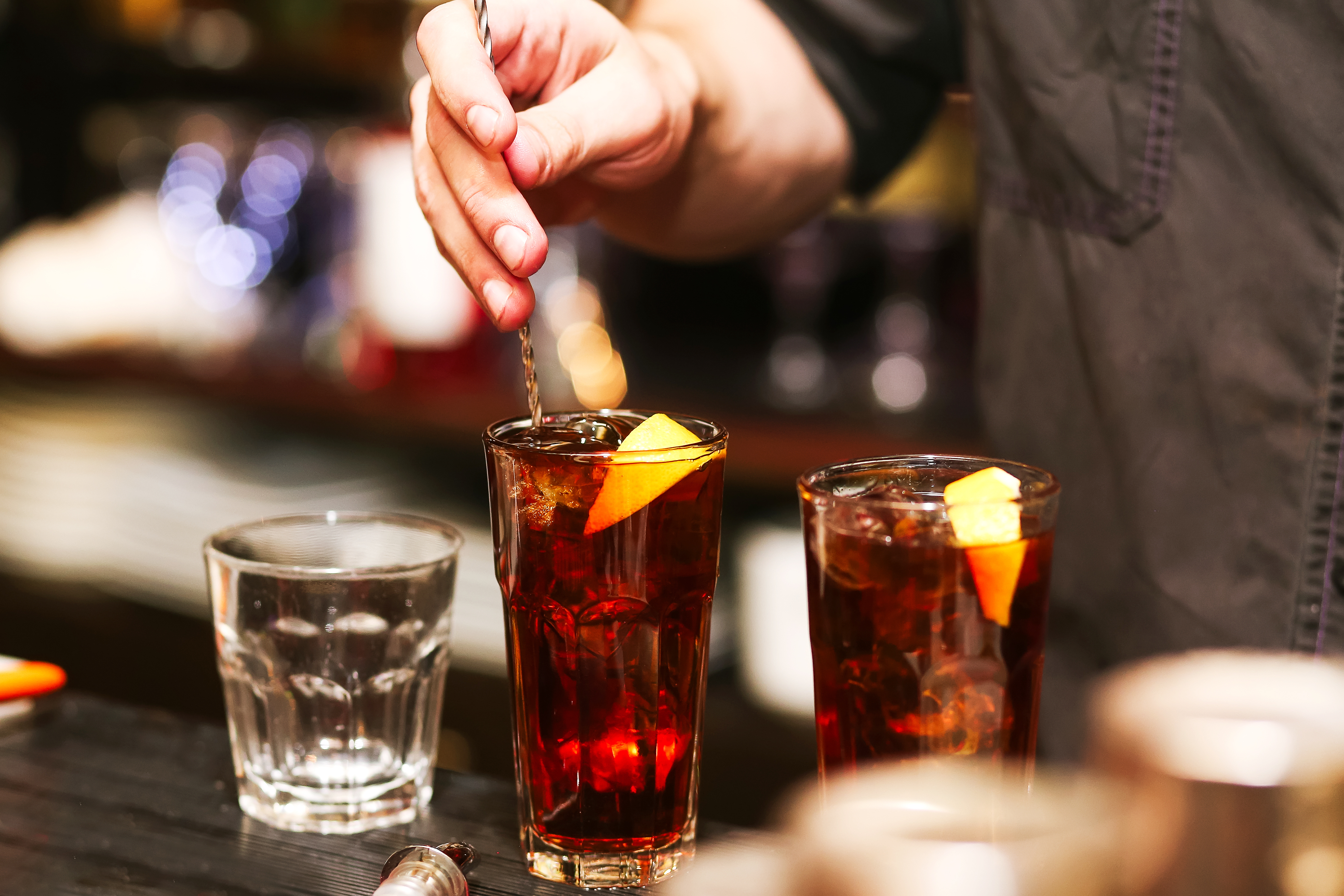 Barman stir alcohol. process of preparing a cocktail