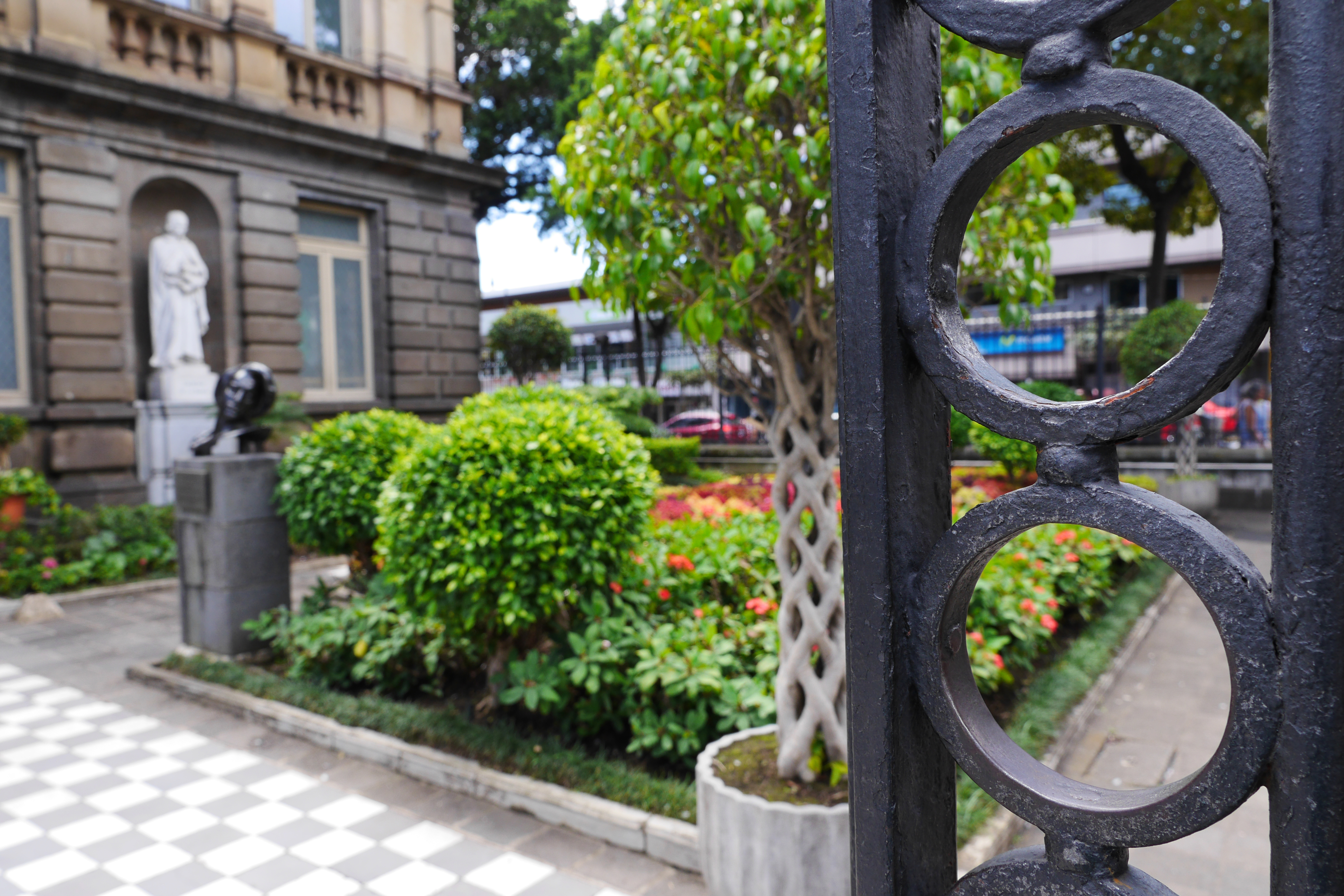 Behind the iron gate is the garden pathway into the National Theater in San Jose