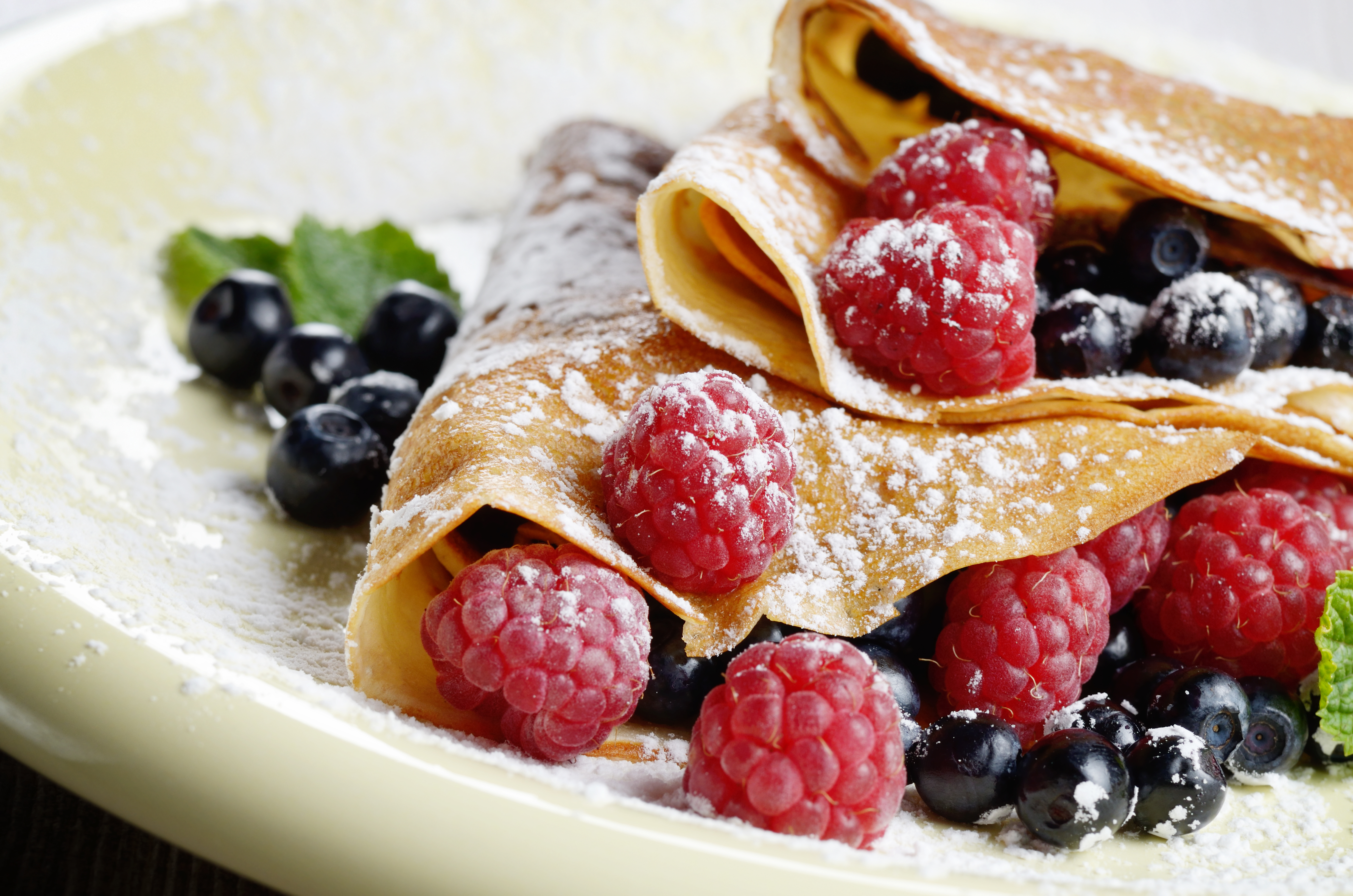 Delicious Tasty Homemade crepes with raspberries