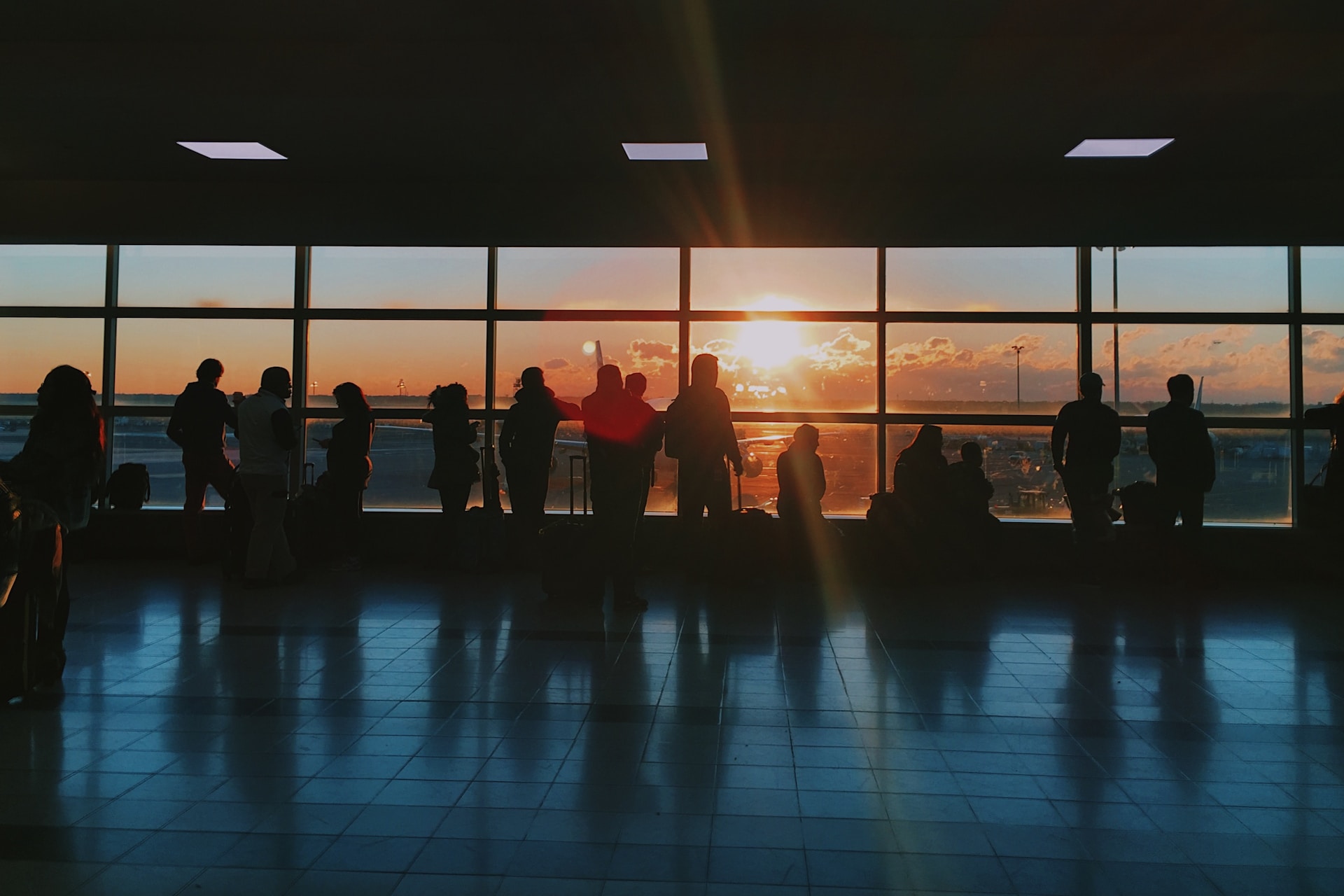 silhouette of people at airport